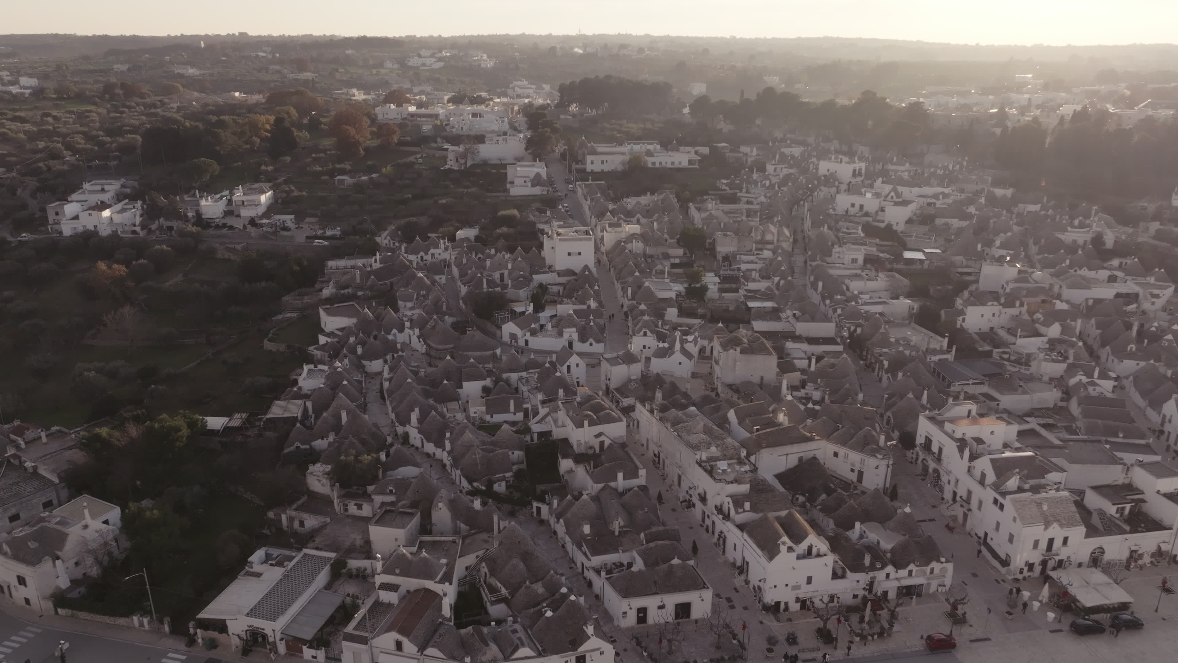 Drone View Of UNESCO World Heritage-listed Trulli Of Alberobello At Sunset