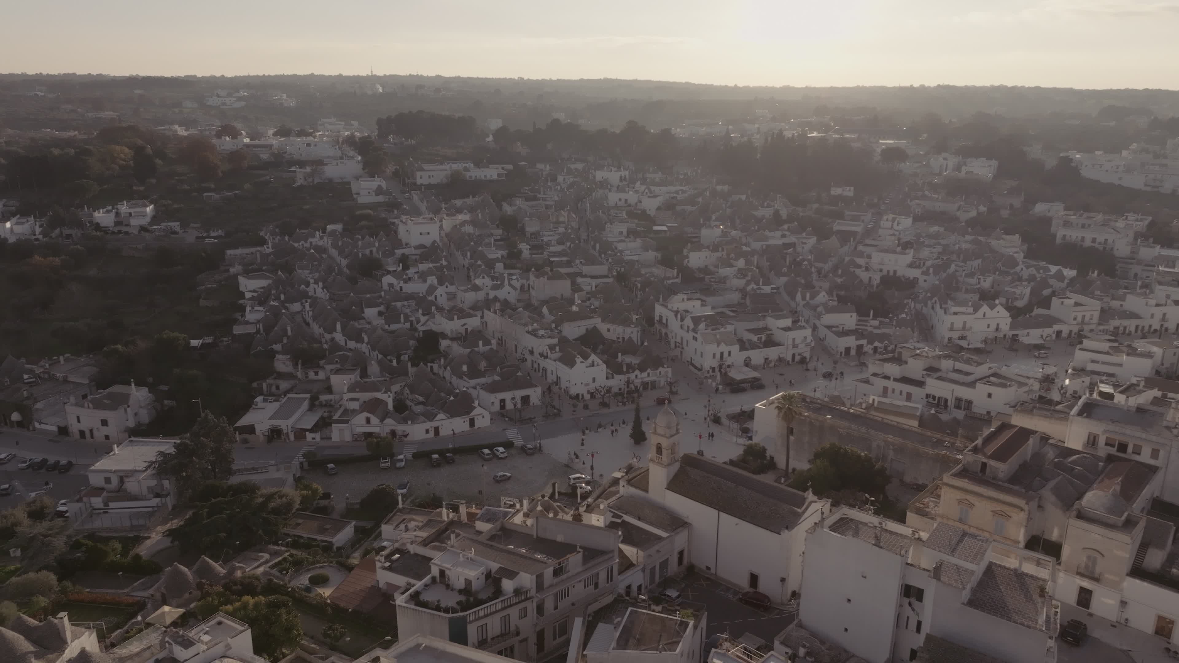 Drone View Of UNESCO World Heritage-listed Trulli Of Alberobello At Sunset