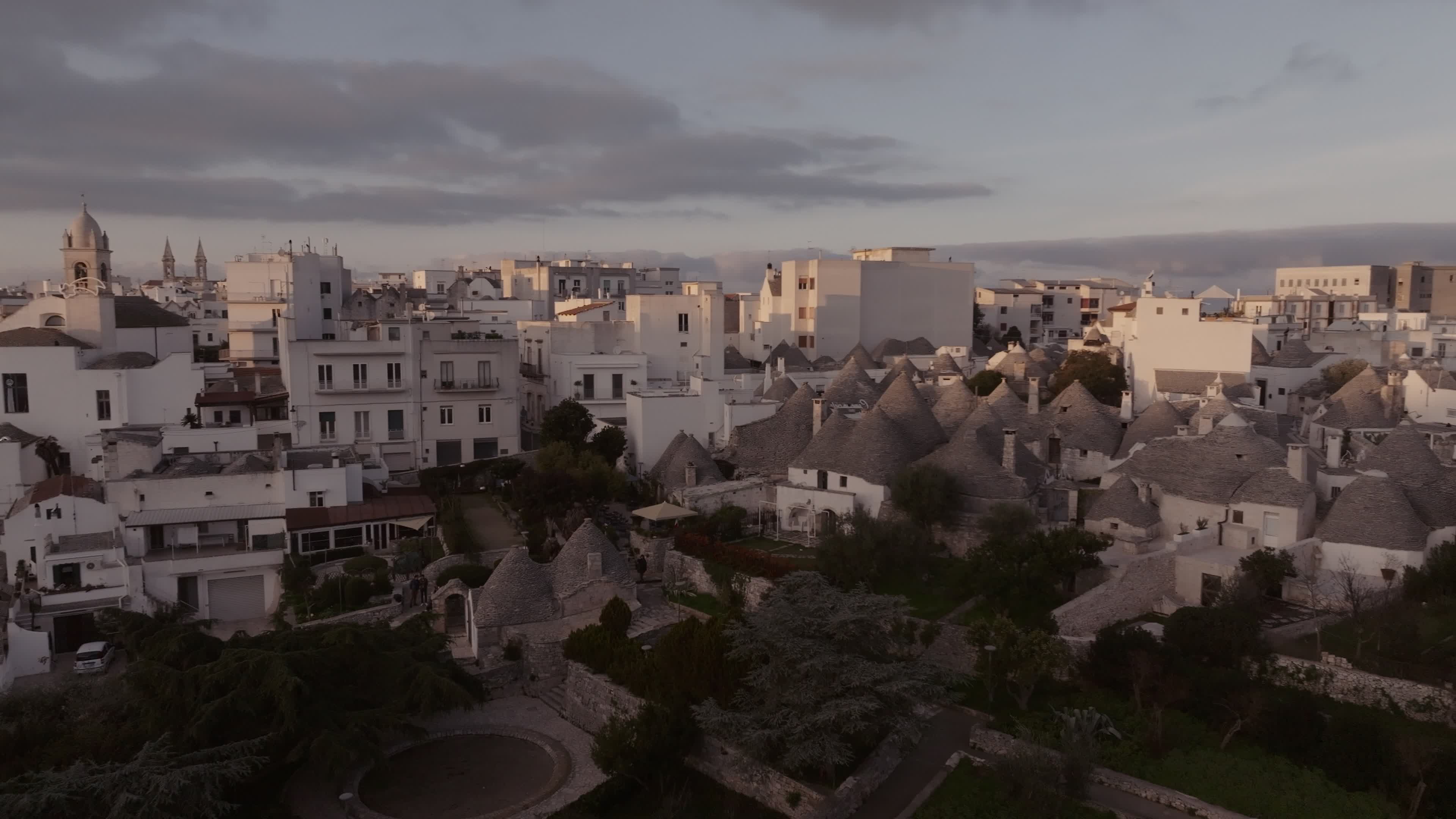Drone View Of UNESCO World Heritage-listed Trulli Of Alberobello At Sunset