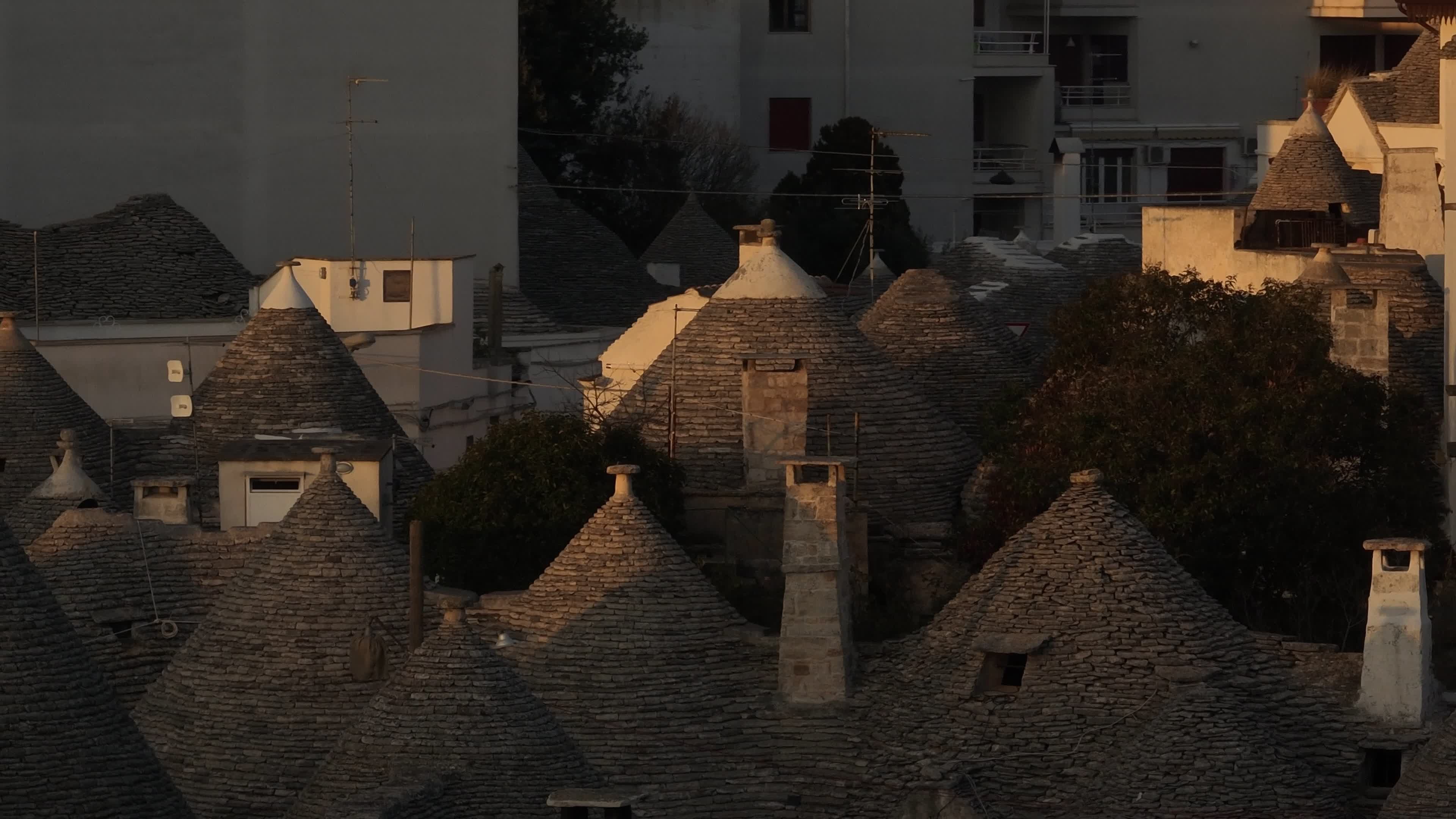 Drone View Of UNESCO World Heritage-listed Trulli Of Alberobello At Sunset