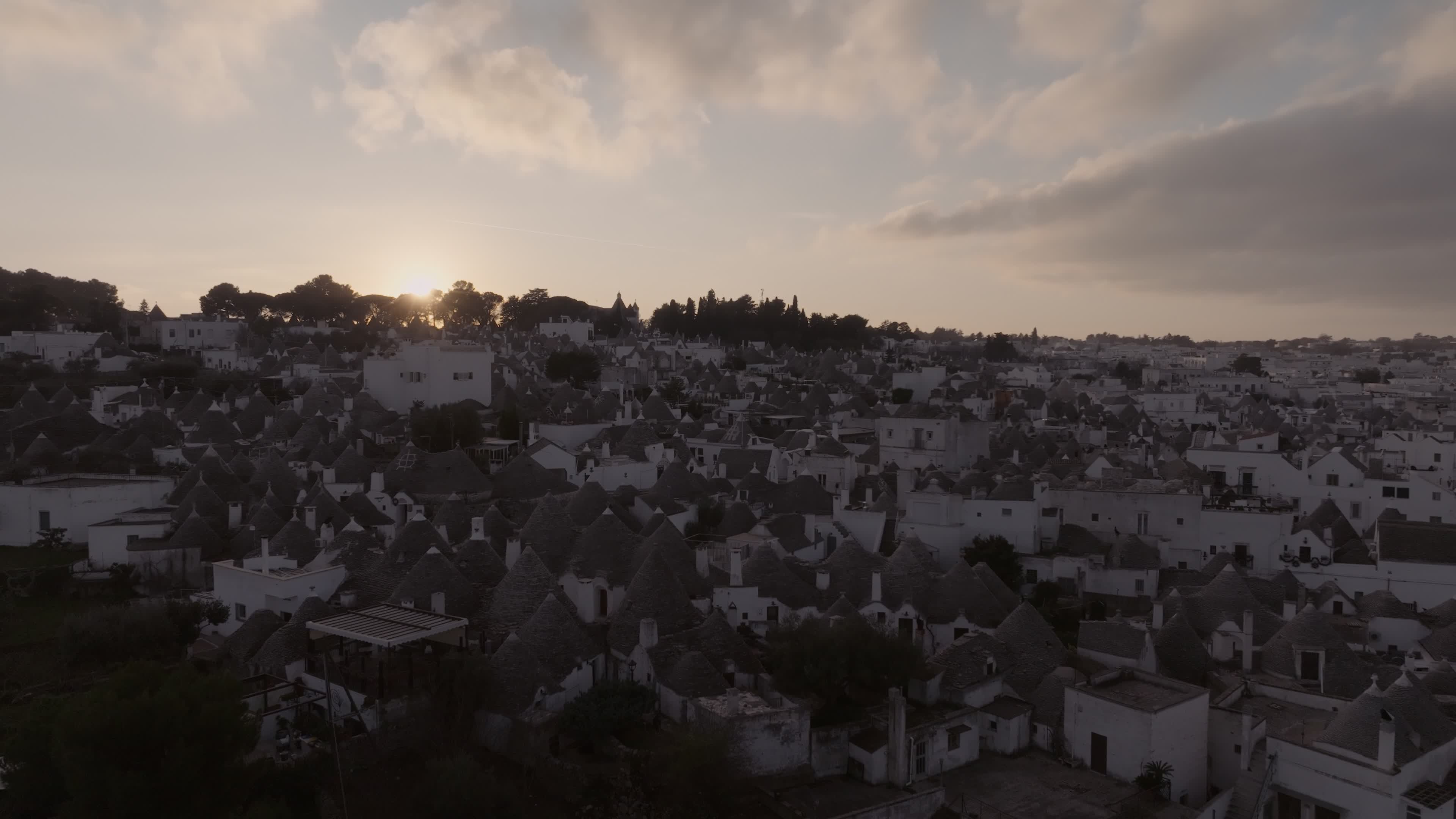 Drone View Of UNESCO World Heritage-listed Trulli Of Alberobello At Sunset