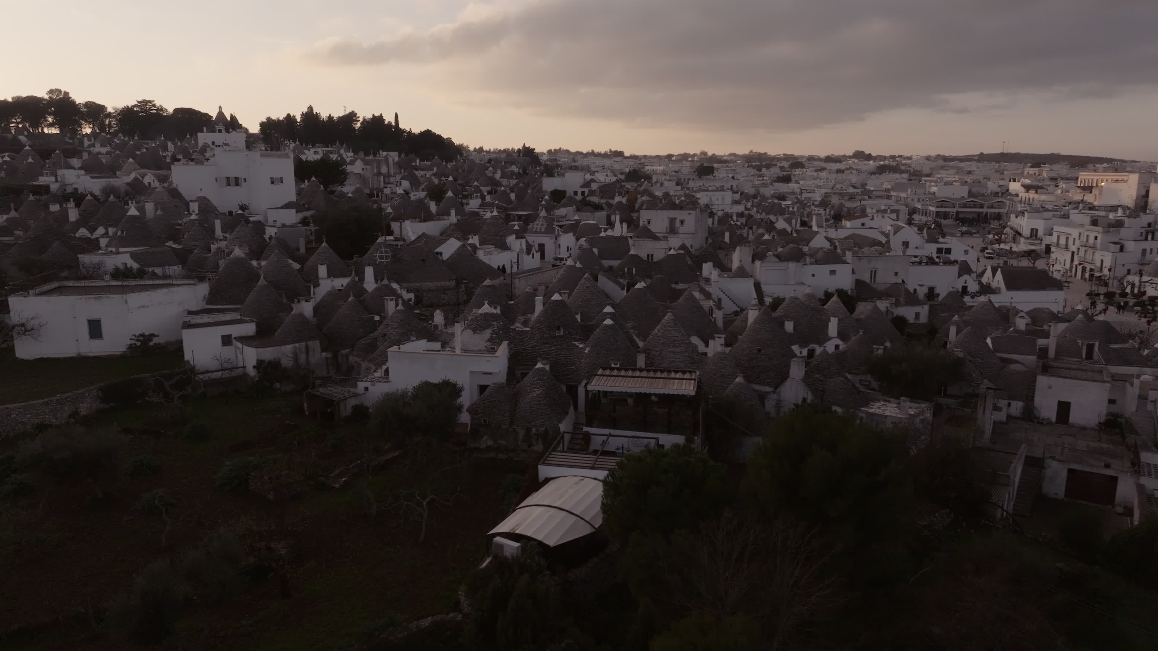 Drone View Of UNESCO World Heritage-listed Trulli Of Alberobello At Sunset