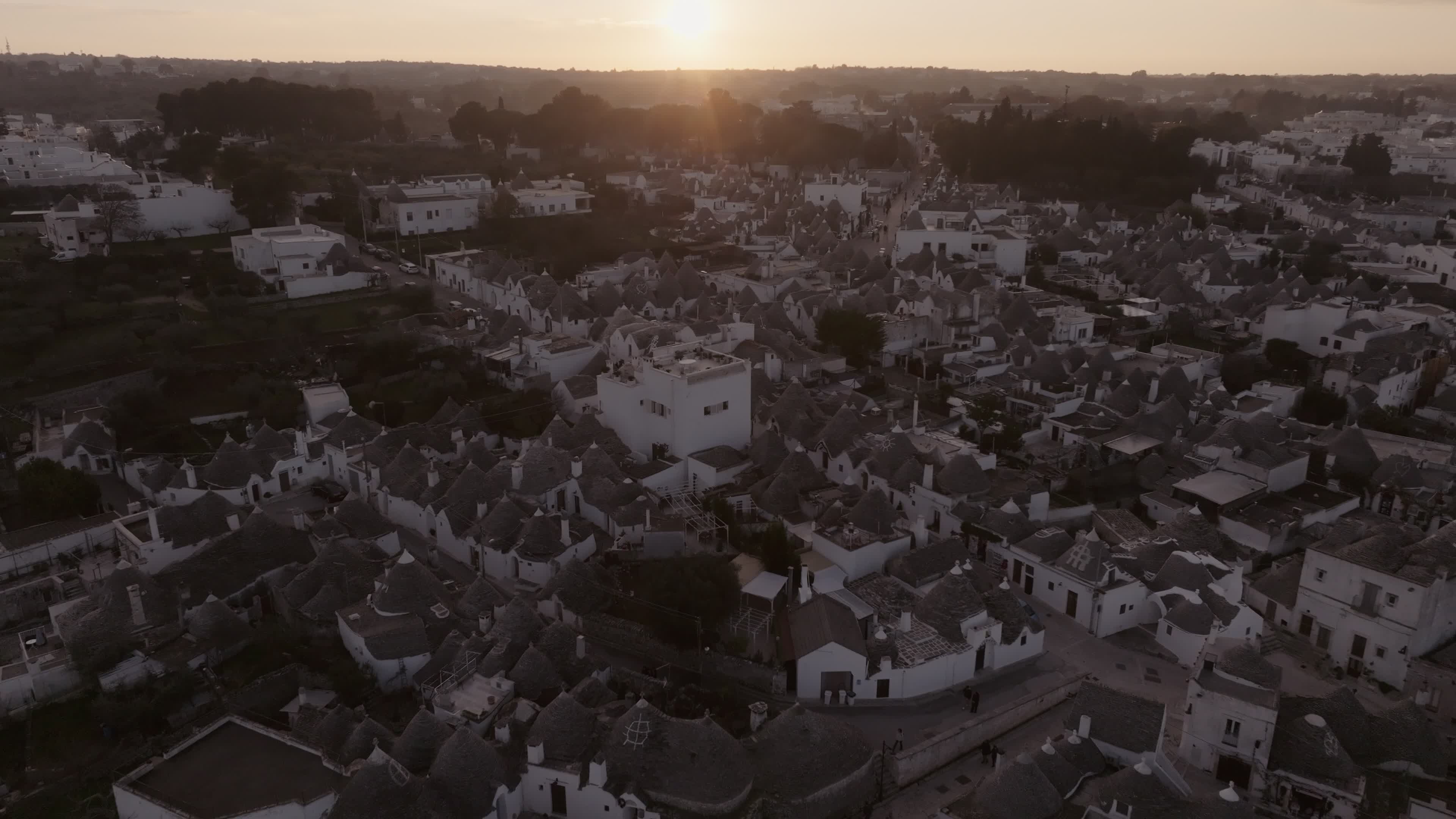 Drone View Of UNESCO World Heritage-listed Trulli Of Alberobello At Sunset