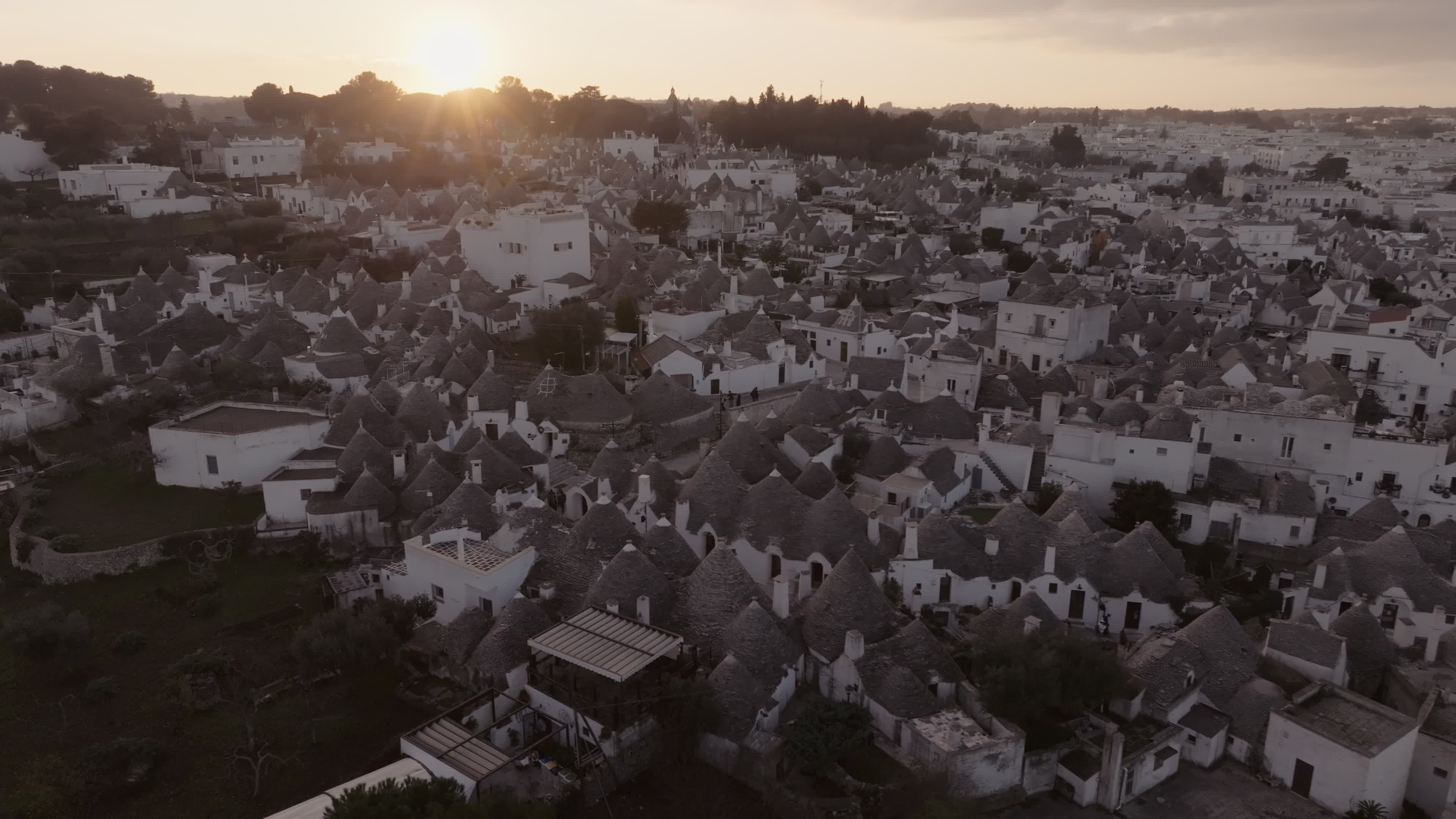 Drone View Of UNESCO World Heritage-listed Trulli Of Alberobello At Sunset