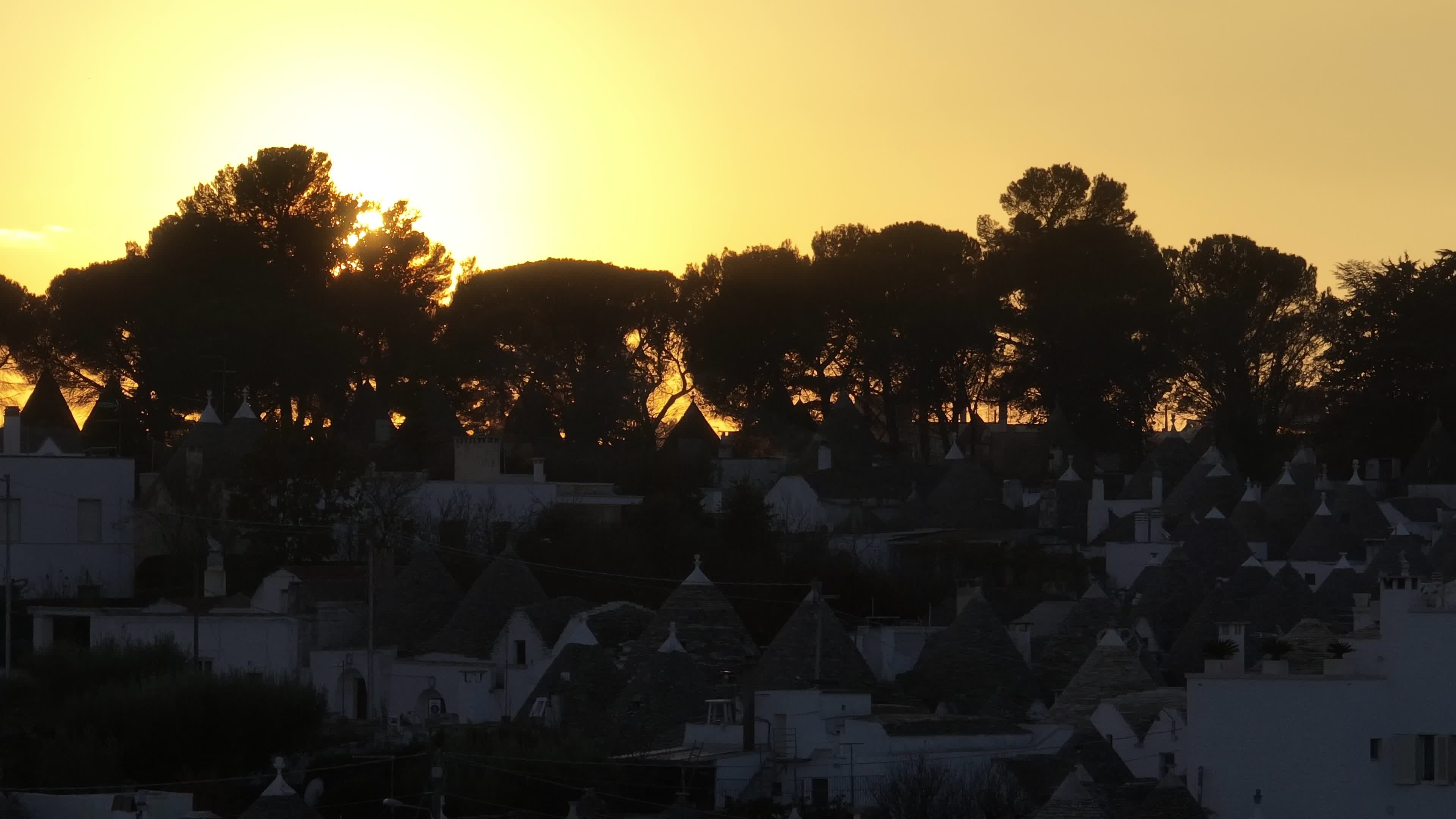 Drone View Of UNESCO World Heritage-listed Trulli Of Alberobello At Sunset