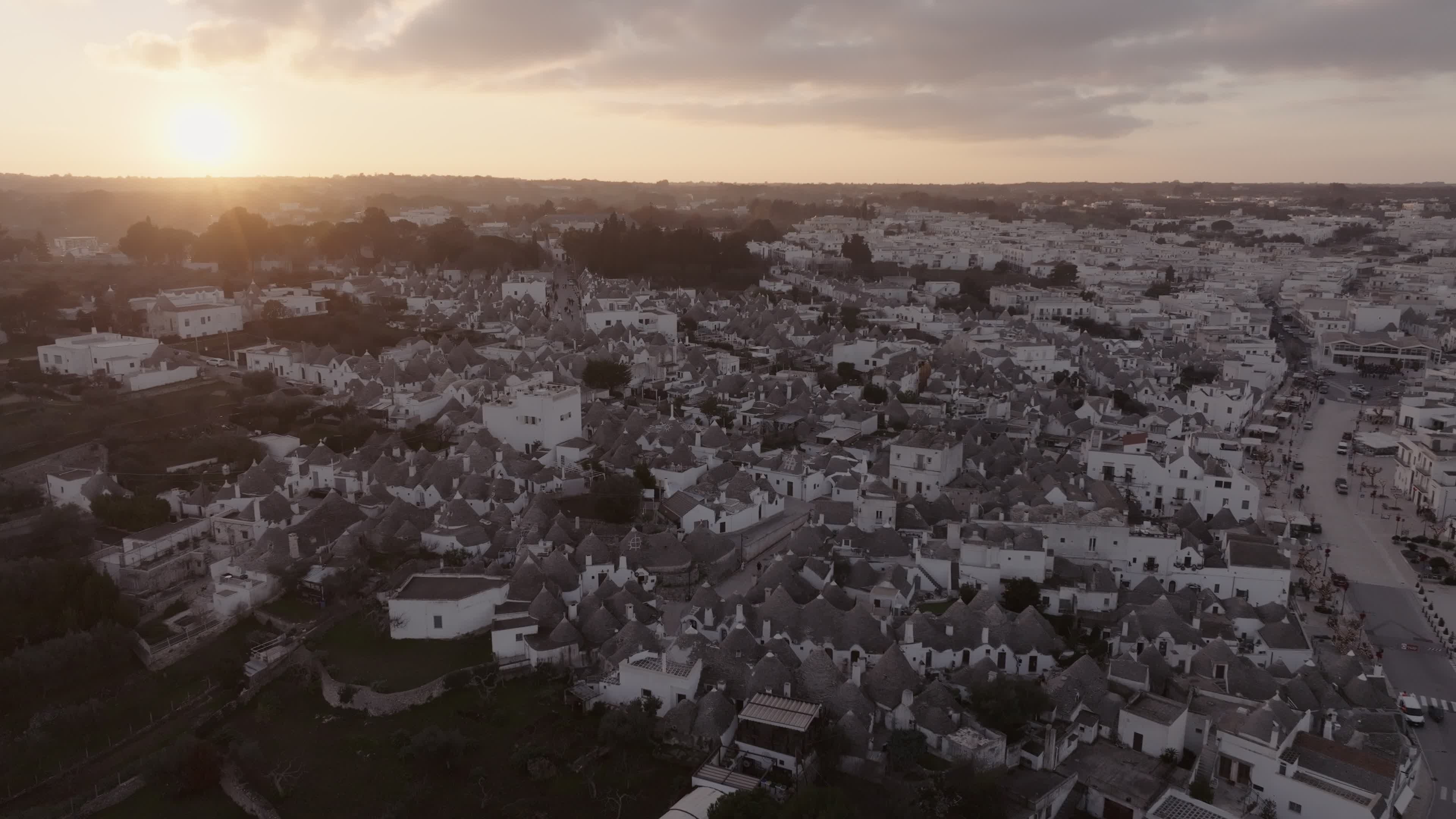 Drone View Of UNESCO World Heritage-listed Trulli Of Alberobello At Sunset