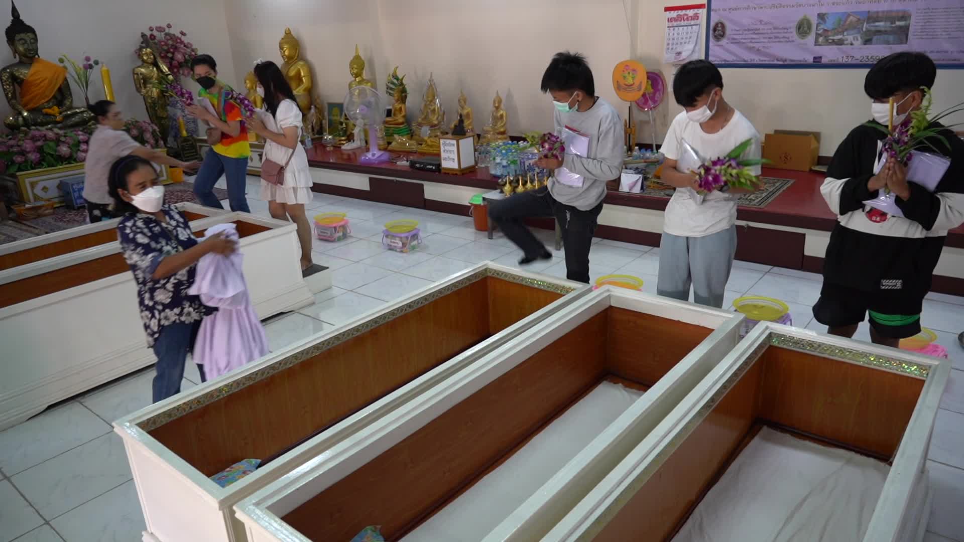 Thai People Lie in Coffins to Welcome in New Year in Bangkok.