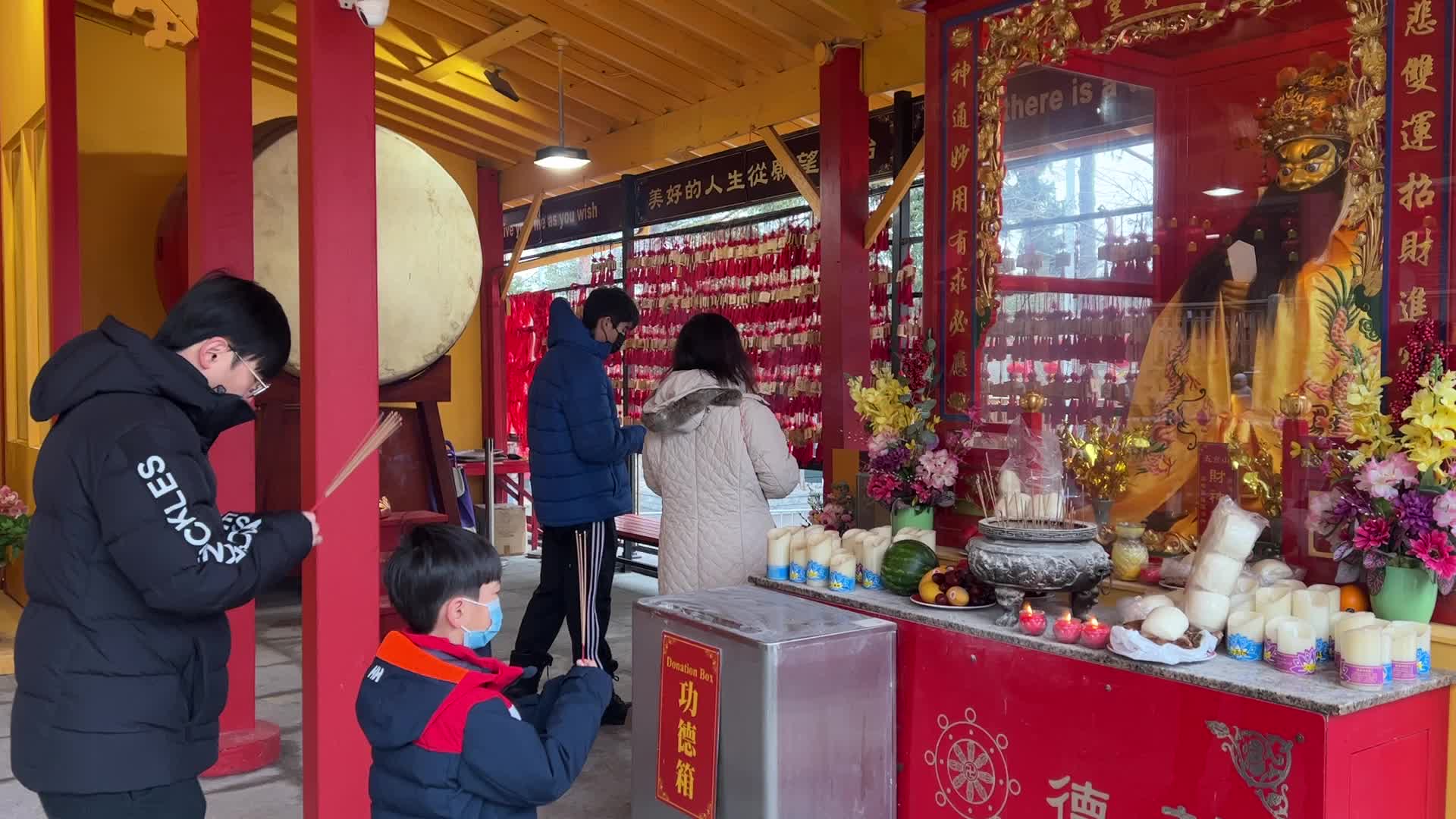 Chinese Buddhists offer prayers on the eve of the Lunar New Year