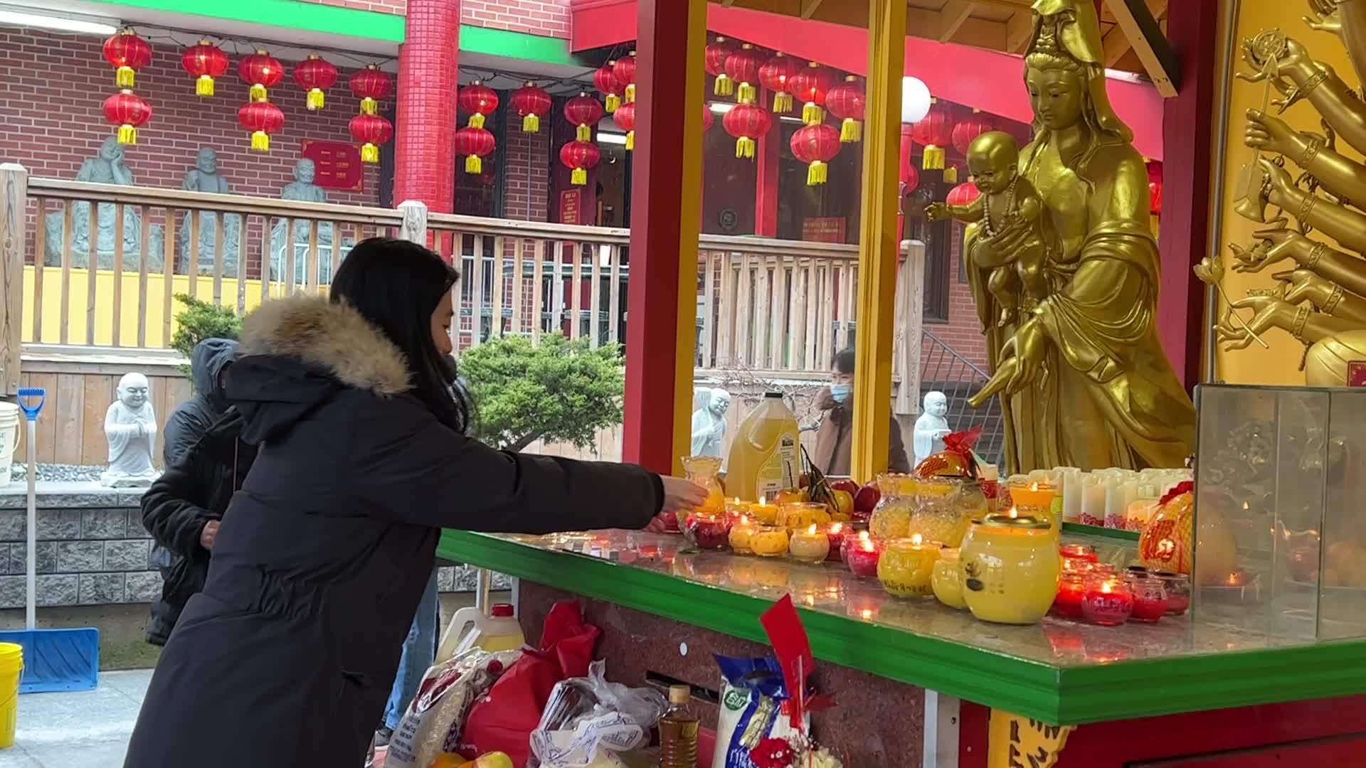 Chinese Buddhists offer prayers on the eve of the Lunar New Year