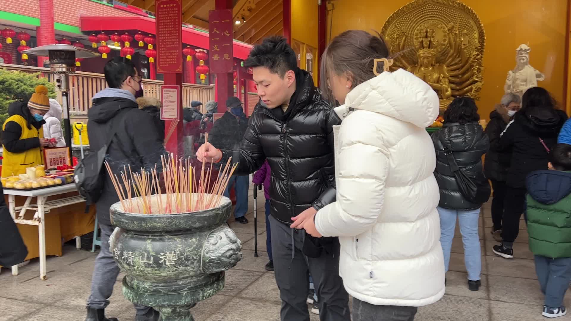Chinese Buddhists offer prayers on the eve of the Lunar New Year