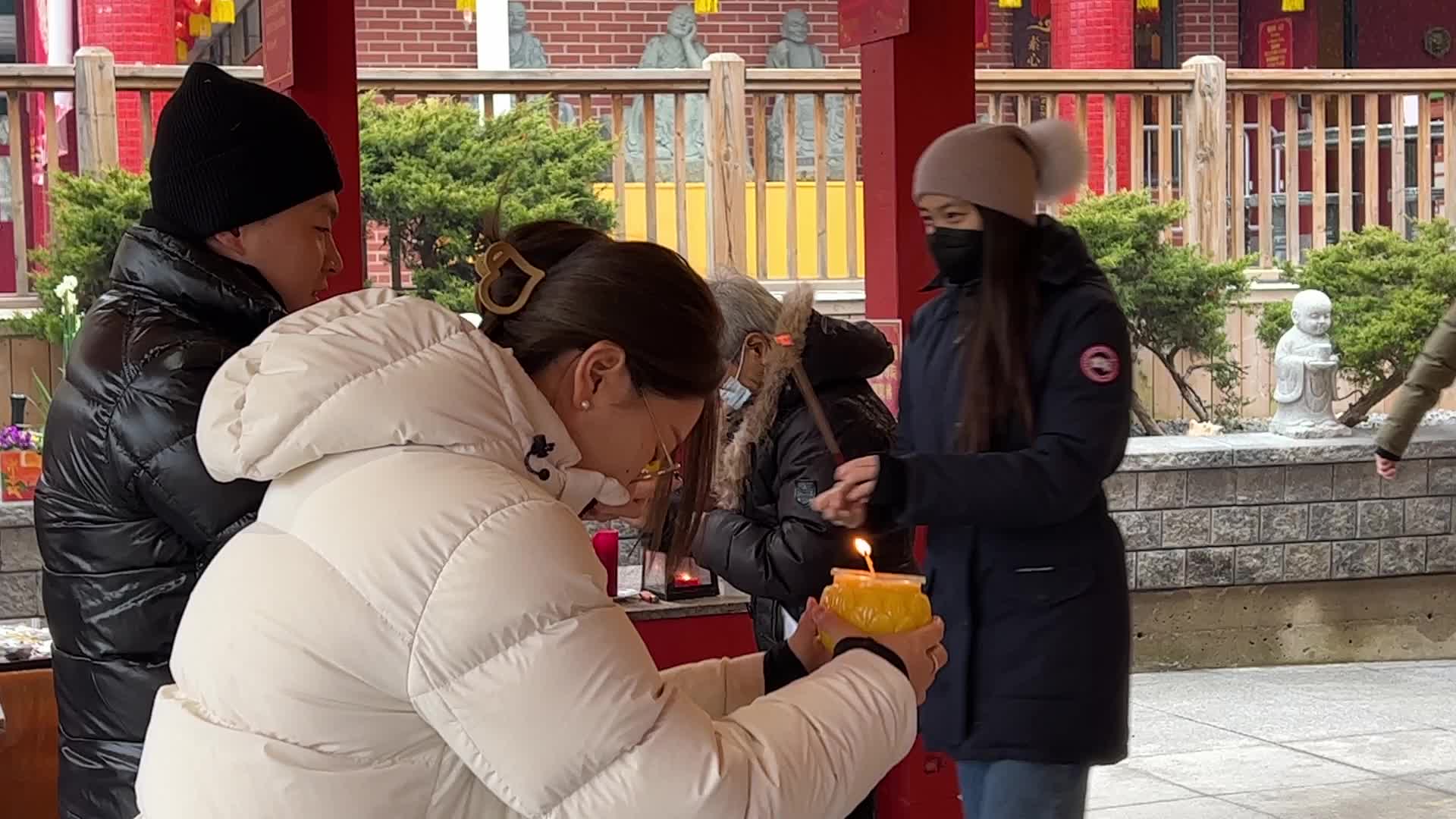 Chinese Buddhists offer prayers on the eve of the Lunar New Year