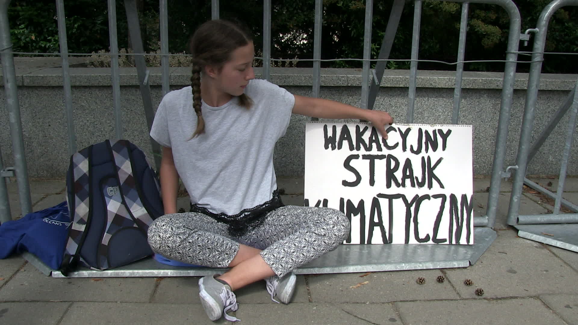 Thirteen year old protests in defence of climate change at Polish Parliament