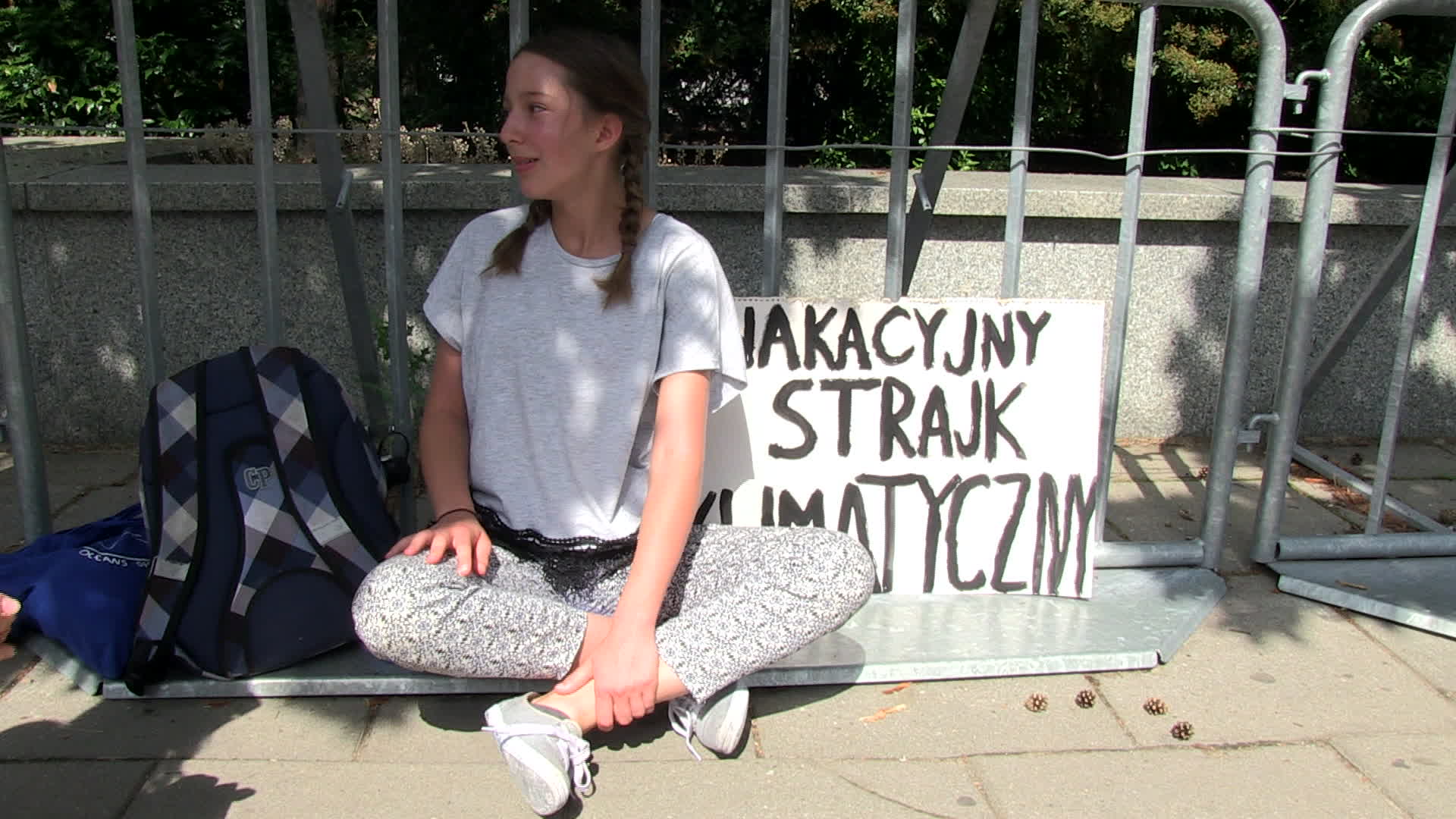Thirteen year old protests in defence of climate change at Polish Parliament