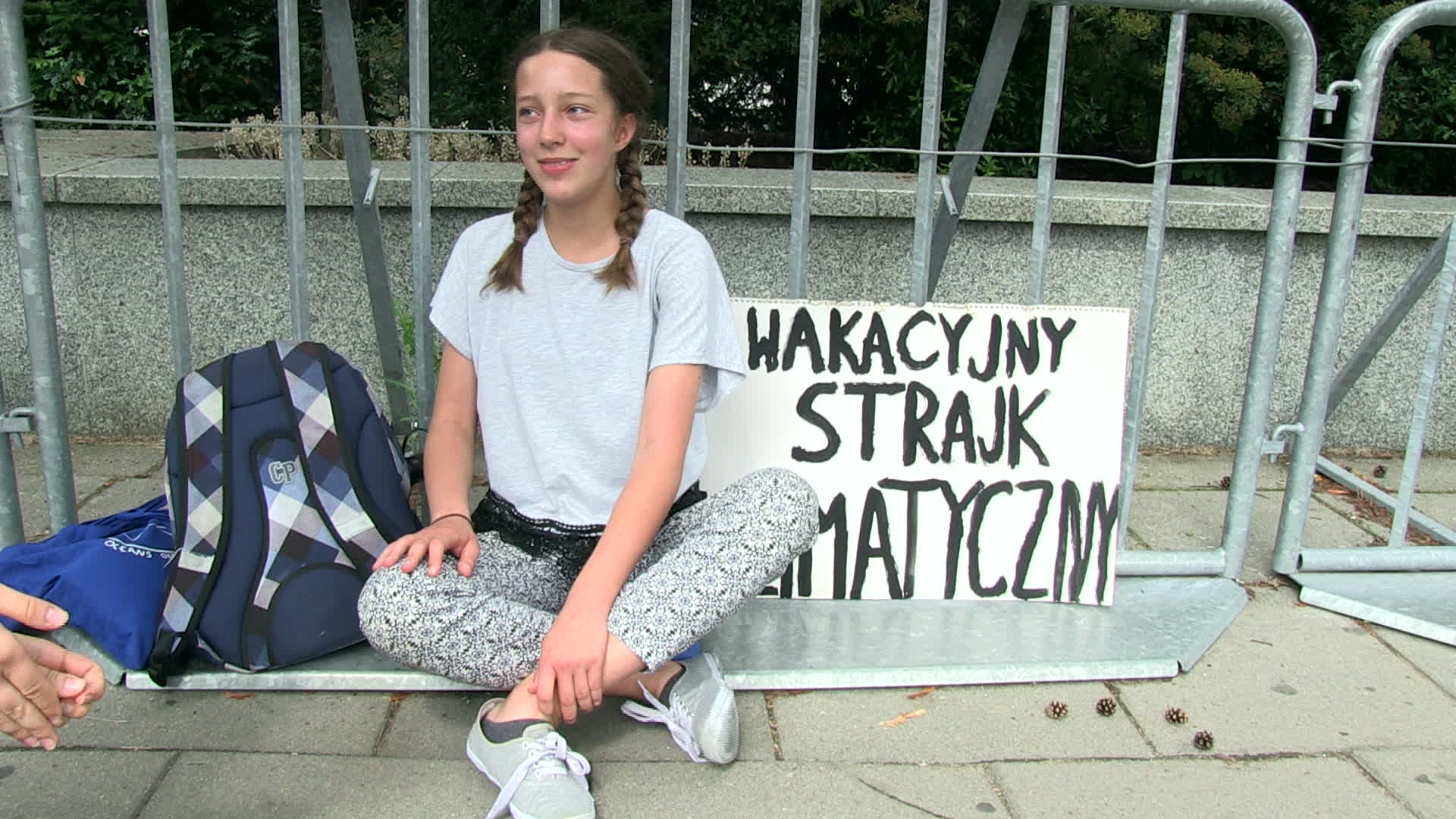 Thirteen year old protests in defence of climate change at Polish Parliament