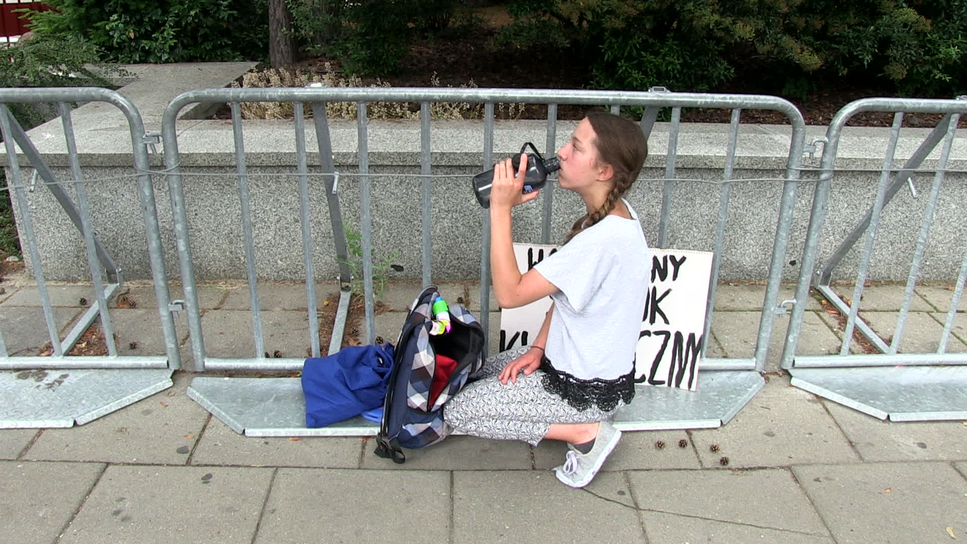 Thirteen year old protests in defence of climate change at Polish Parliament
