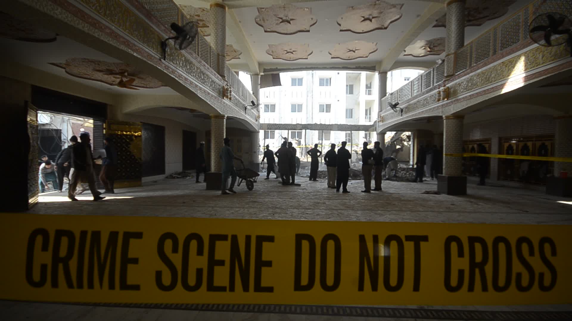 Police secure area of suicide bomb blast at a mosque that killed 100 people