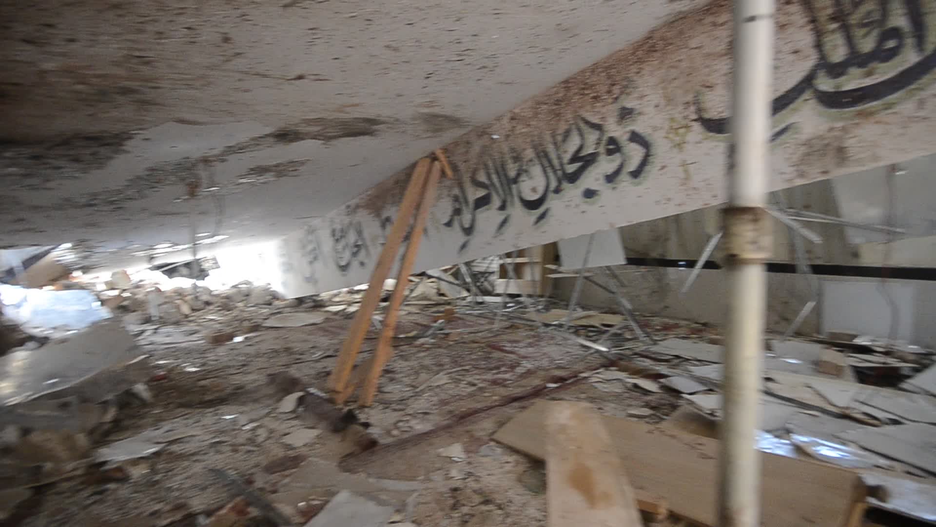 Police survey the scene of suicide blast at the mosque in Peshawar
