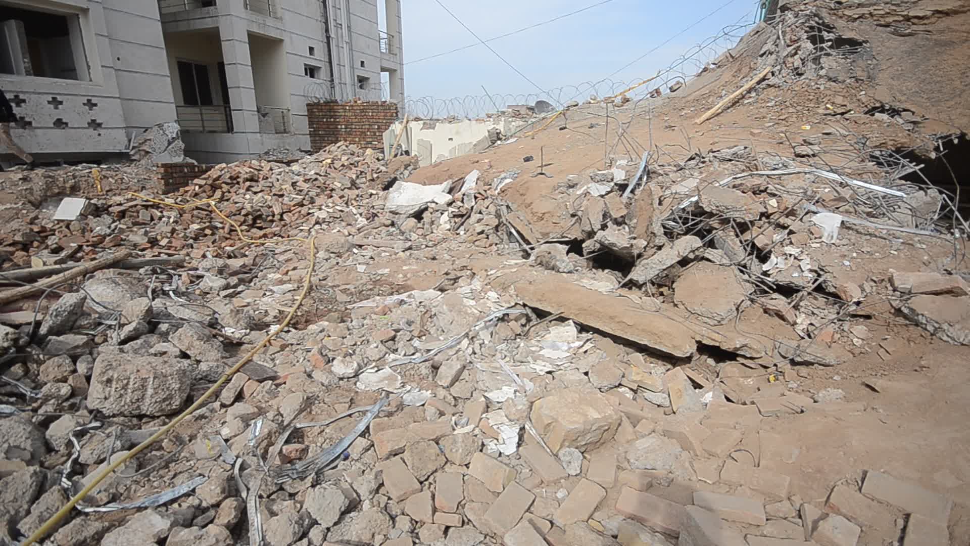 Police survey the scene of suicide blast at the mosque in Peshawar
