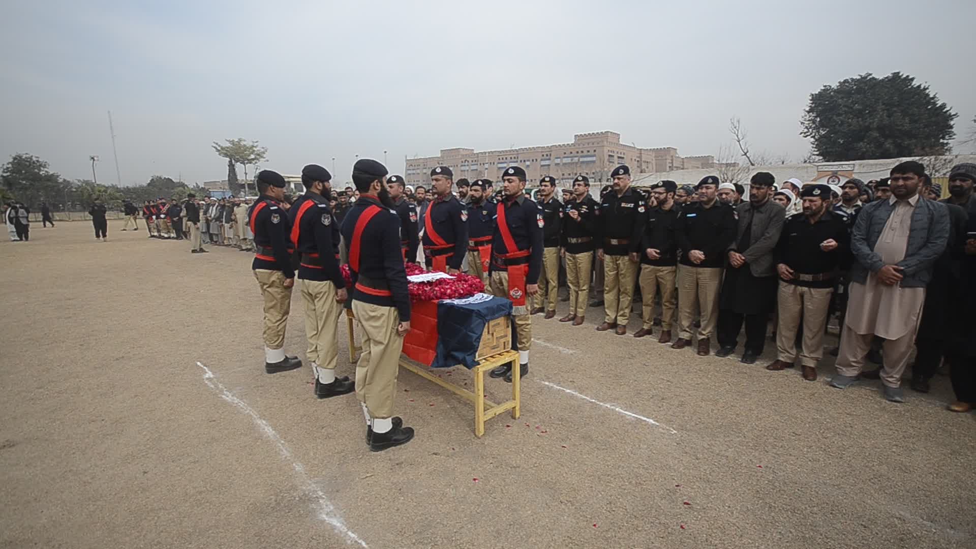 Funeral of a police official killed in a suicide bomb blast at a mosque
