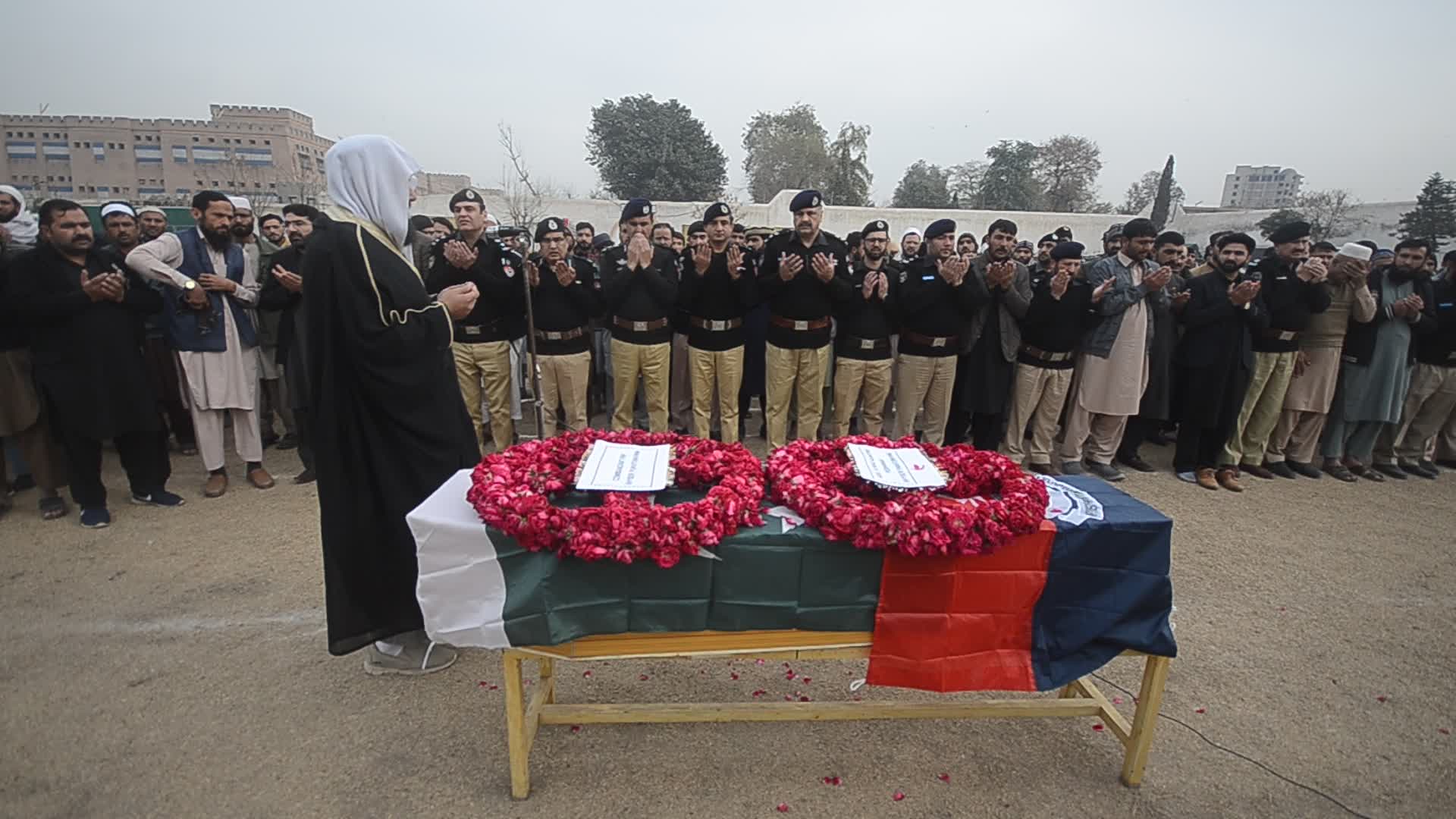 Funeral of a police official killed in a suicide bomb blast at a mosque
