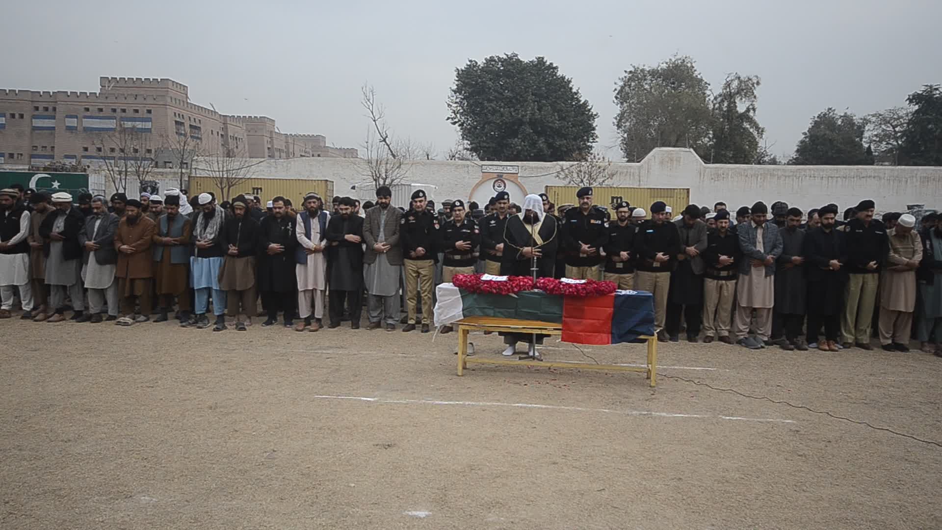 Funeral of a police official killed in a suicide bomb blast at a mosque
