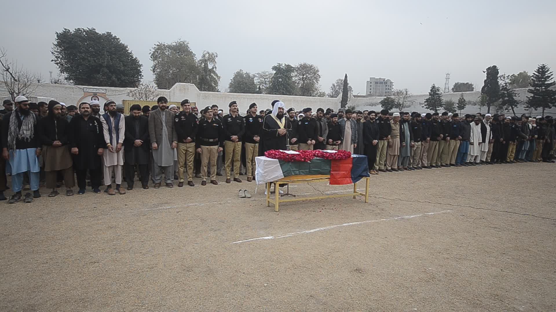 Funeral of a police official killed in a suicide bomb blast at a mosque
