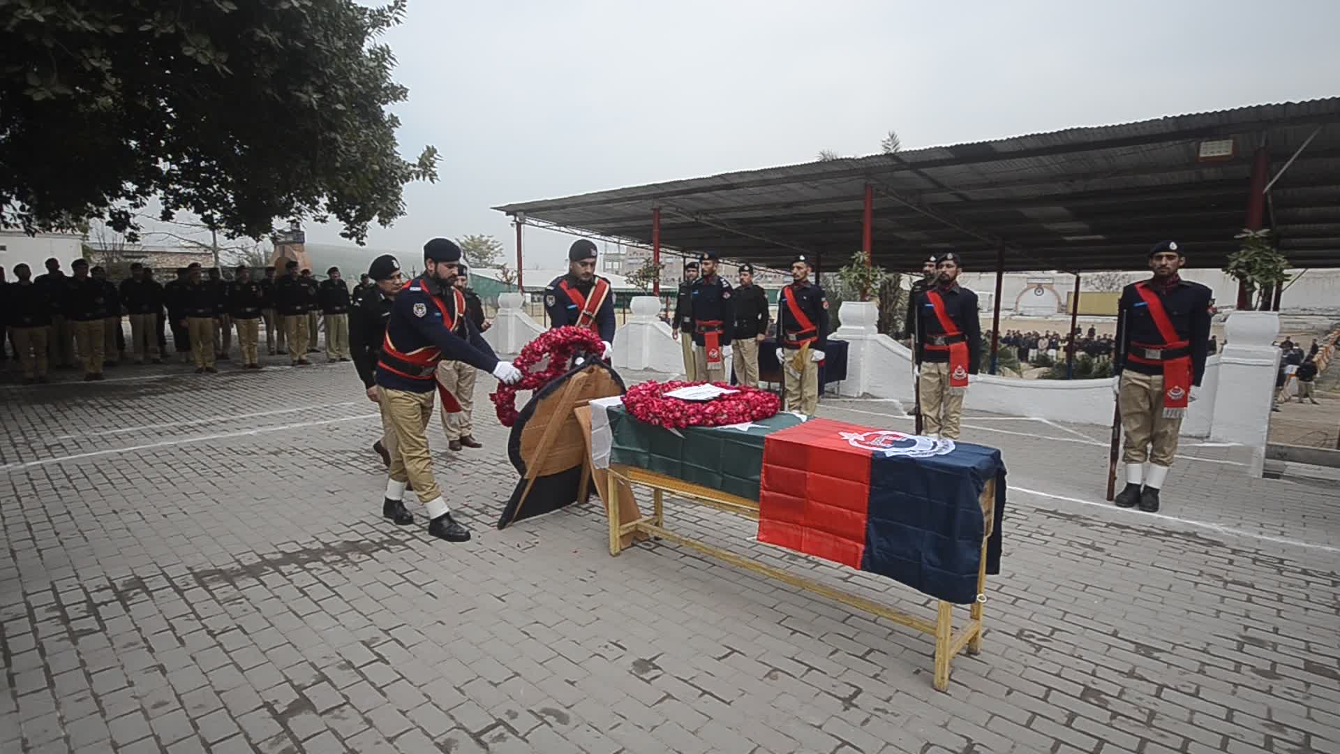 Funeral of a police official killed in a suicide bomb blast at a mosque
