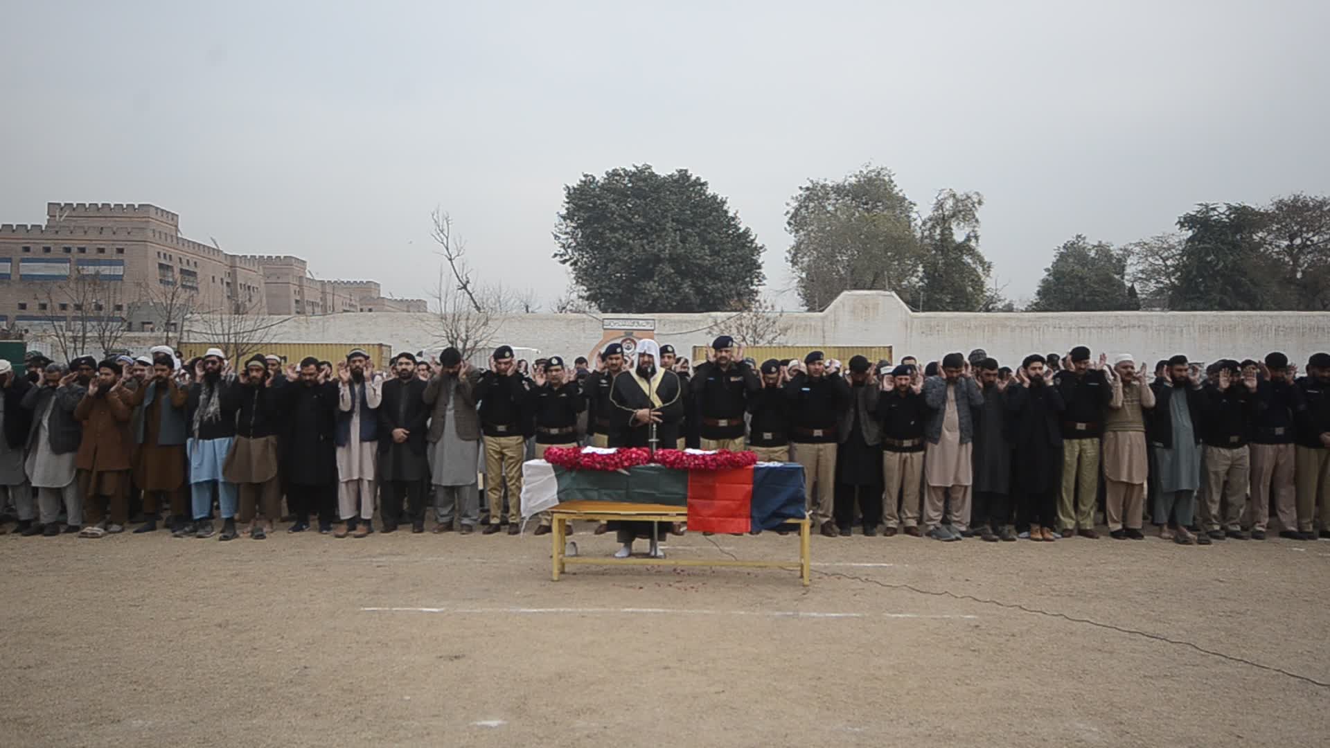 Funeral of a police official killed in a suicide bomb blast at a mosque
