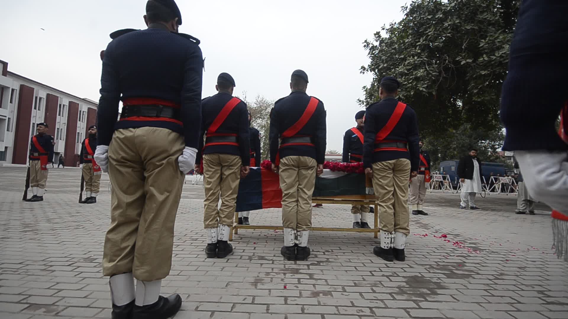 Funeral of a police official killed in a suicide bomb blast at a mosque
