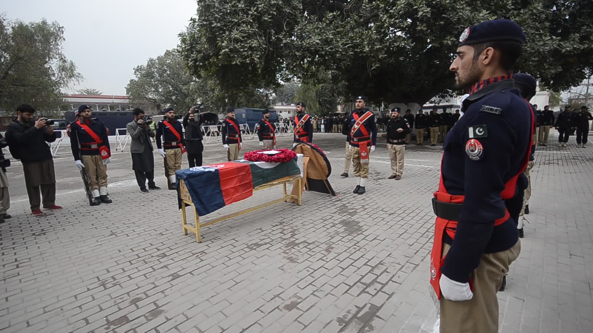 Funeral of a police official killed in a suicide bomb blast at a mosque
