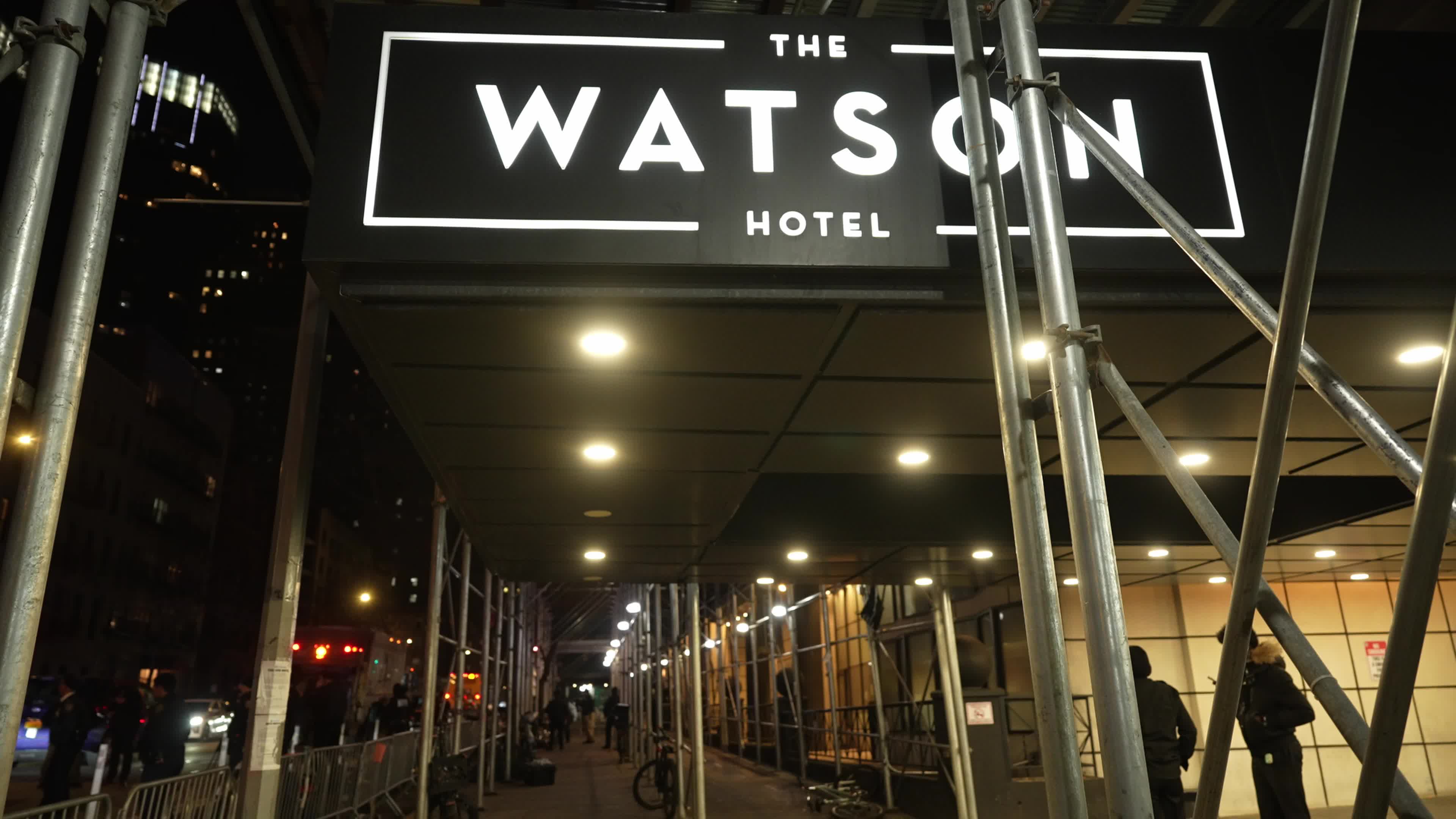 NYPD and sanitation crews clear migrants from Manhattan hotel sidewalk