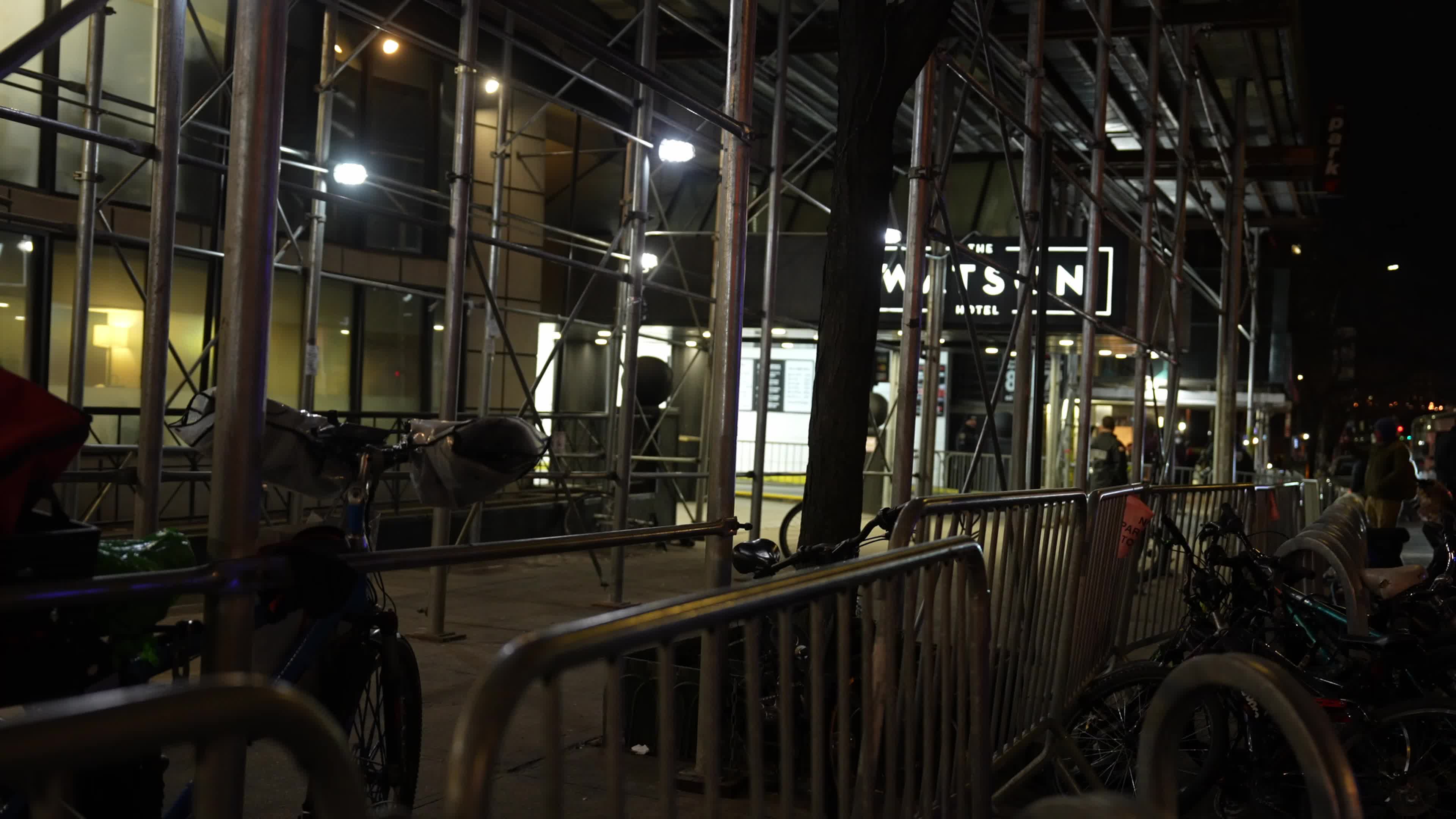 NYPD and sanitation crews clear migrants from Manhattan hotel sidewalk