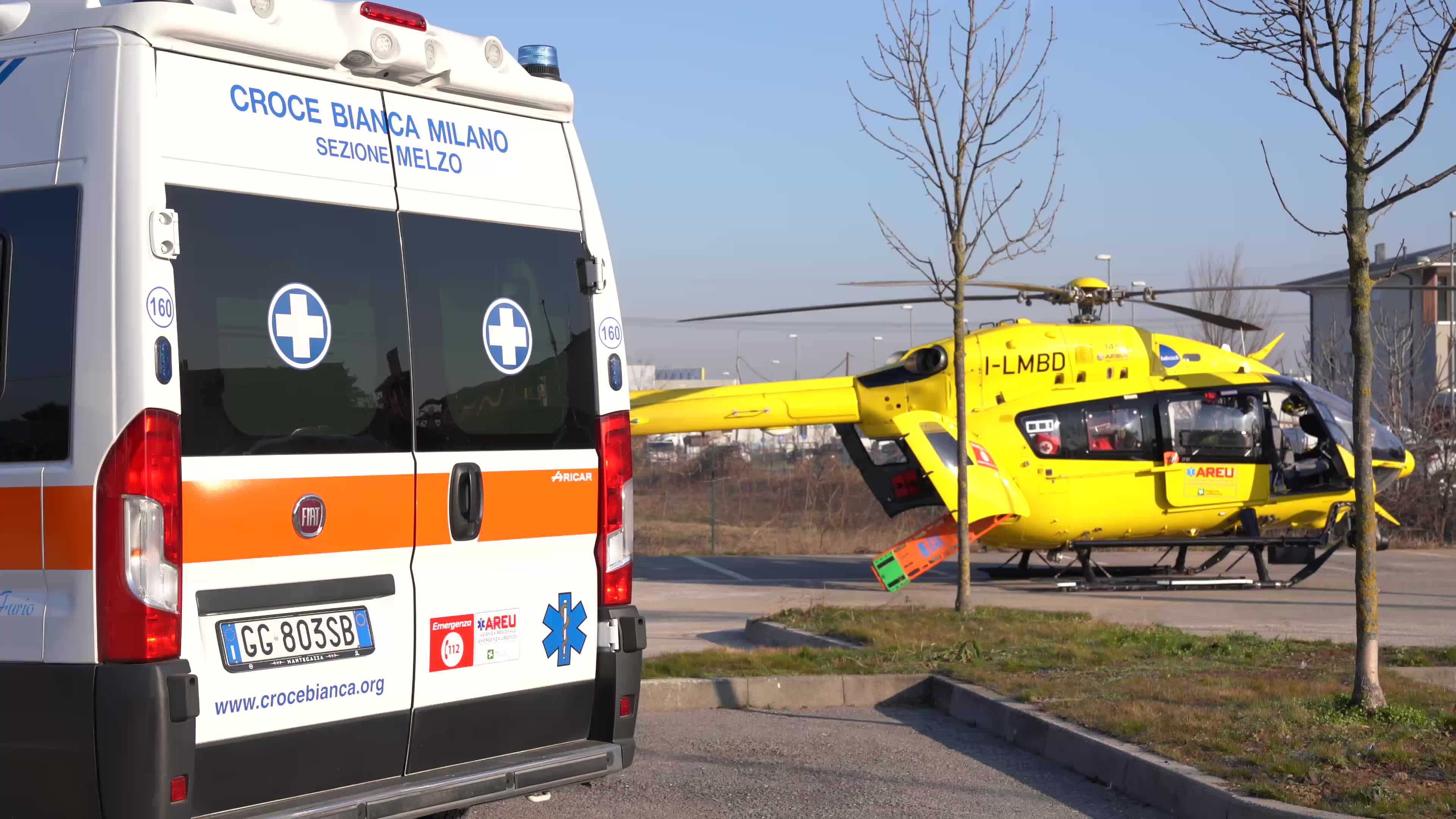Ambulance and Medical helicopter landed in a public car parking