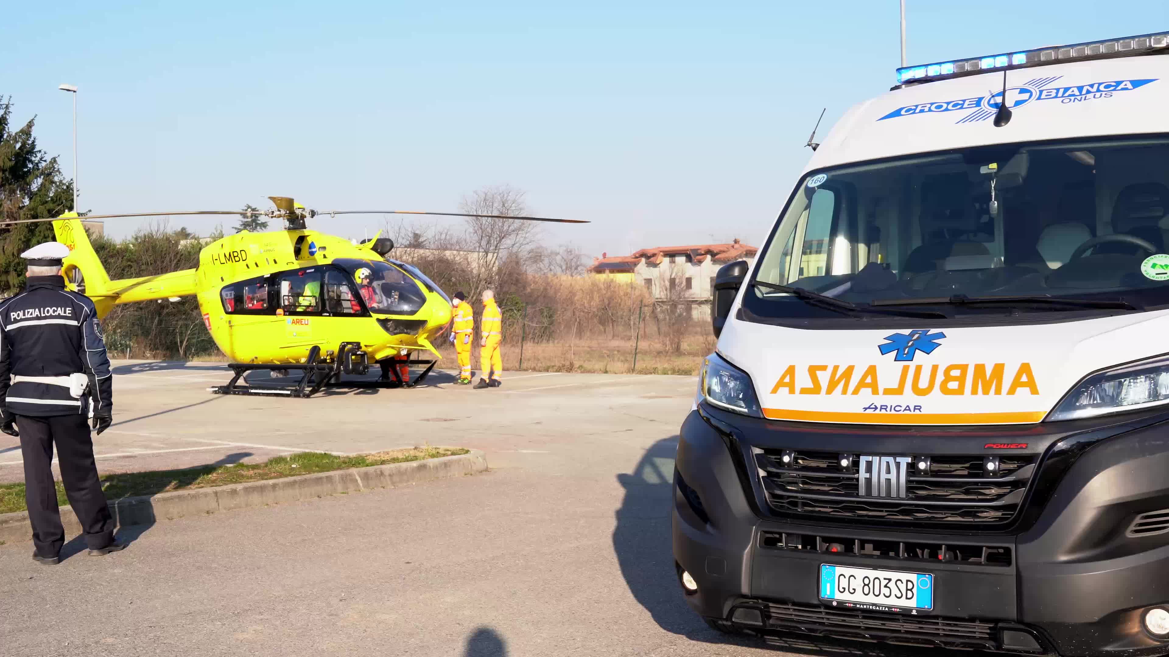 Ambulance and Medical helicopter landed in a public car parking