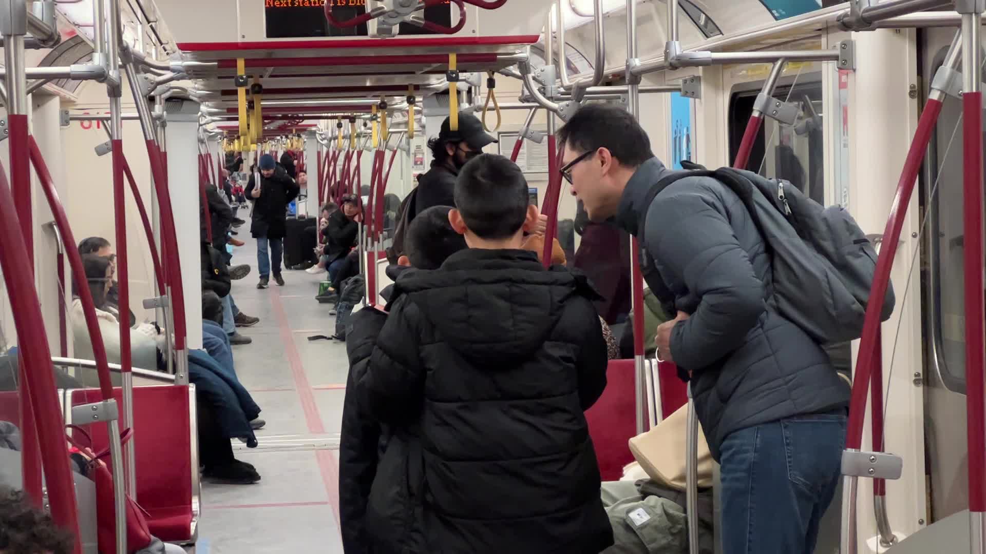 Riders on a TTC subway train in Toronto