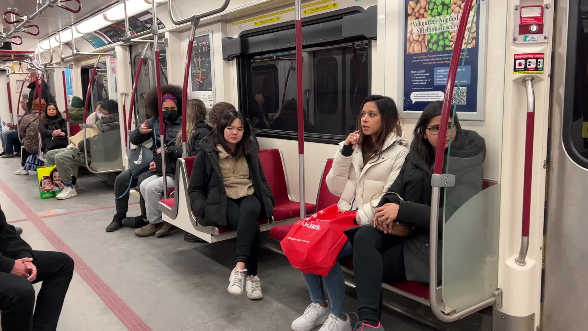 Riders on a TTC subway train in Toronto