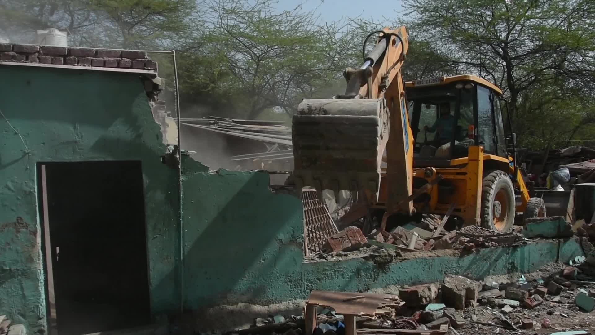 Heavy Machinery Razes Illegal Structures in Mehrauli, Delhi