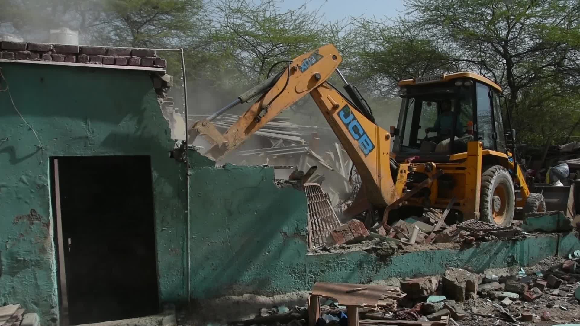 Heavy Machinery Razes Illegal Structures in Mehrauli, Delhi