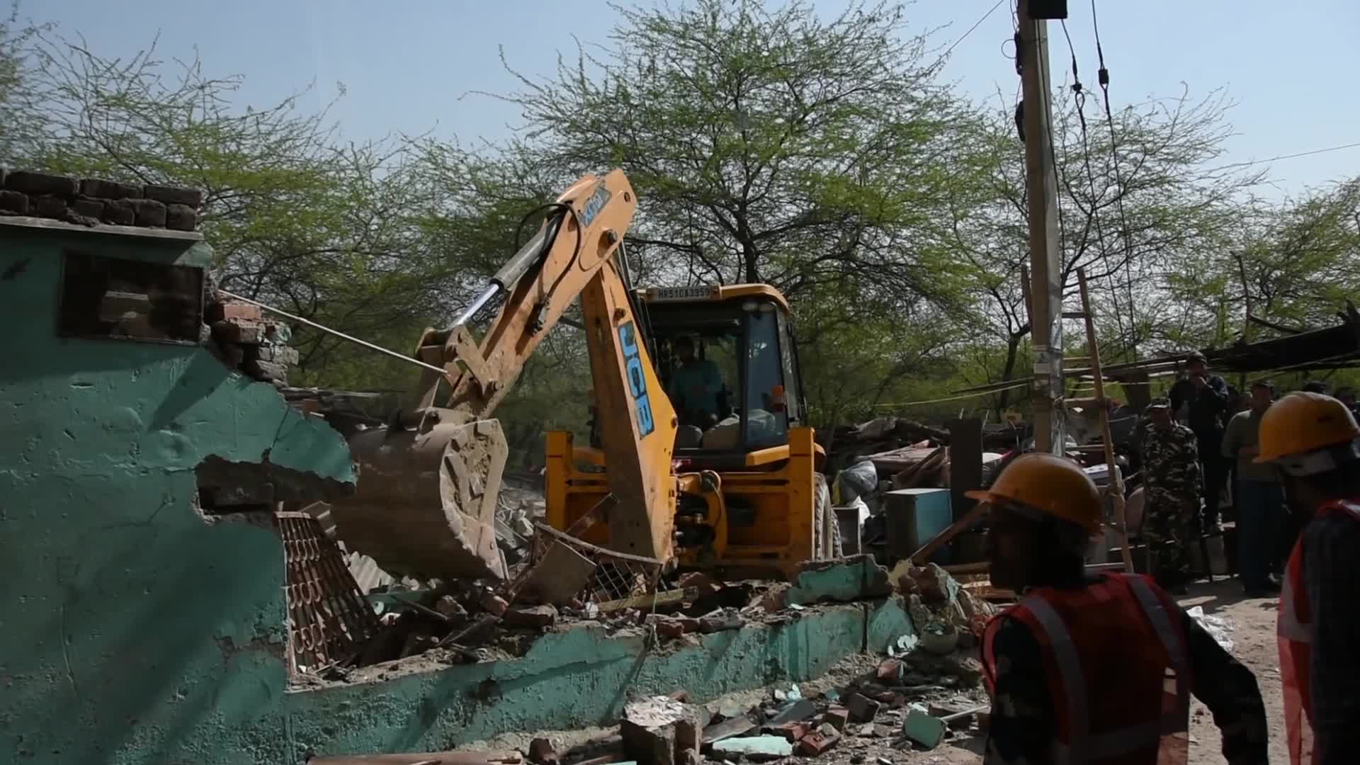 Heavy Machinery Razes Illegal Structures in Mehrauli, Delhi