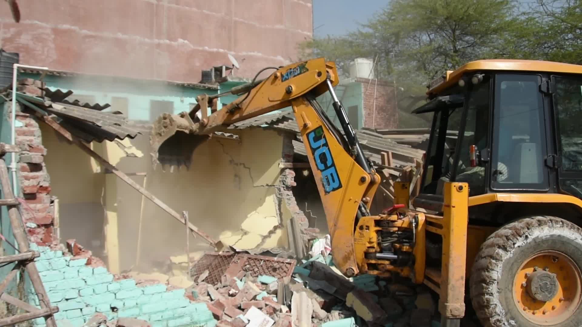 Heavy Machinery Razes Illegal Structures in Mehrauli, Delhi