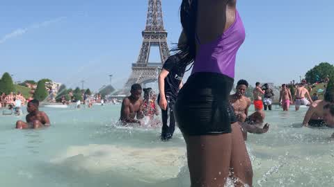 People bathe in the fountain of the Trocadero in Paris to escape the heat wave