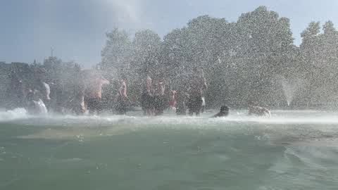 People bathe in the fountain of the Trocadero in Paris to escape the heat wave