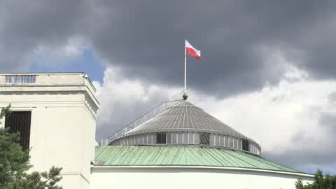 Polish flag flies above Parliament
