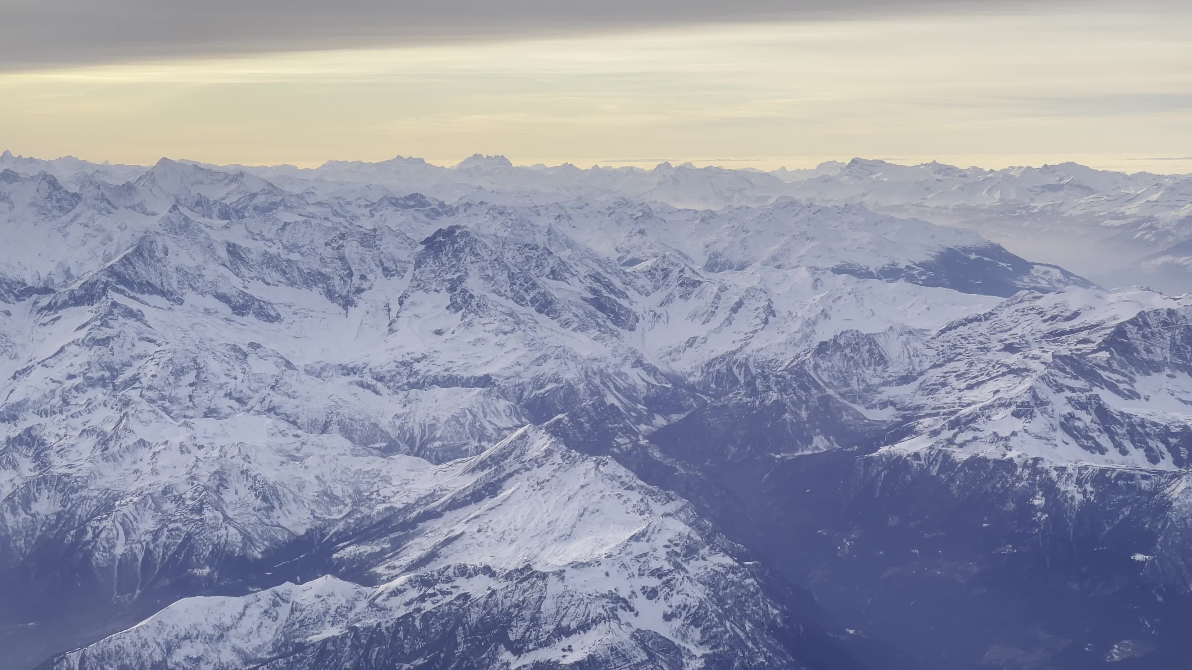 Sunset Over The Alps During A Flight