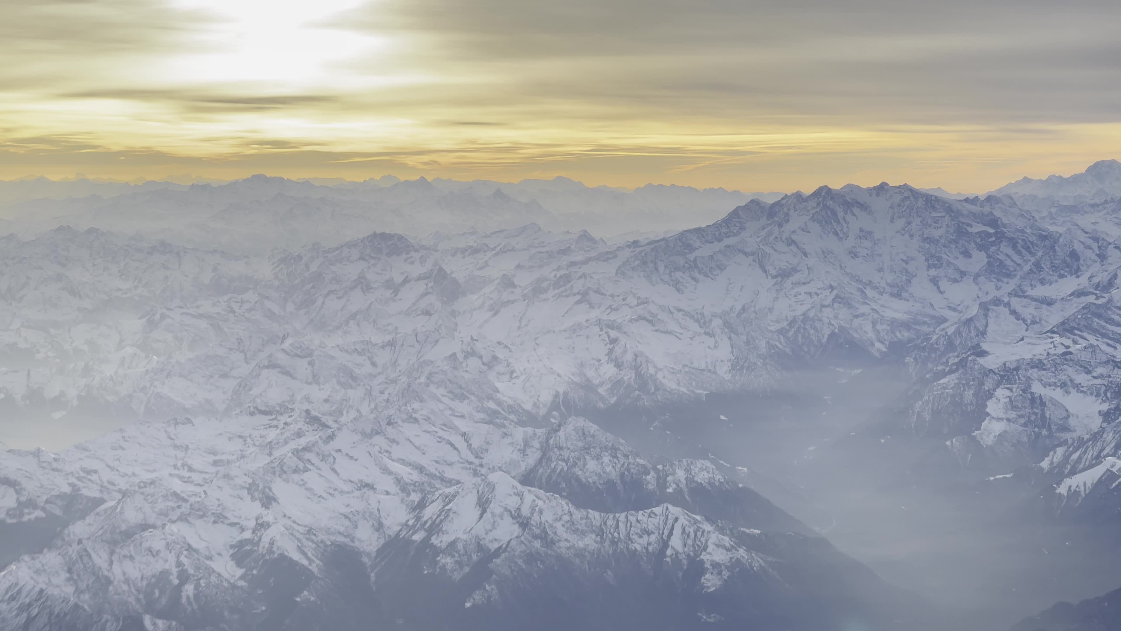 Sunset Over The Alps During A Flight