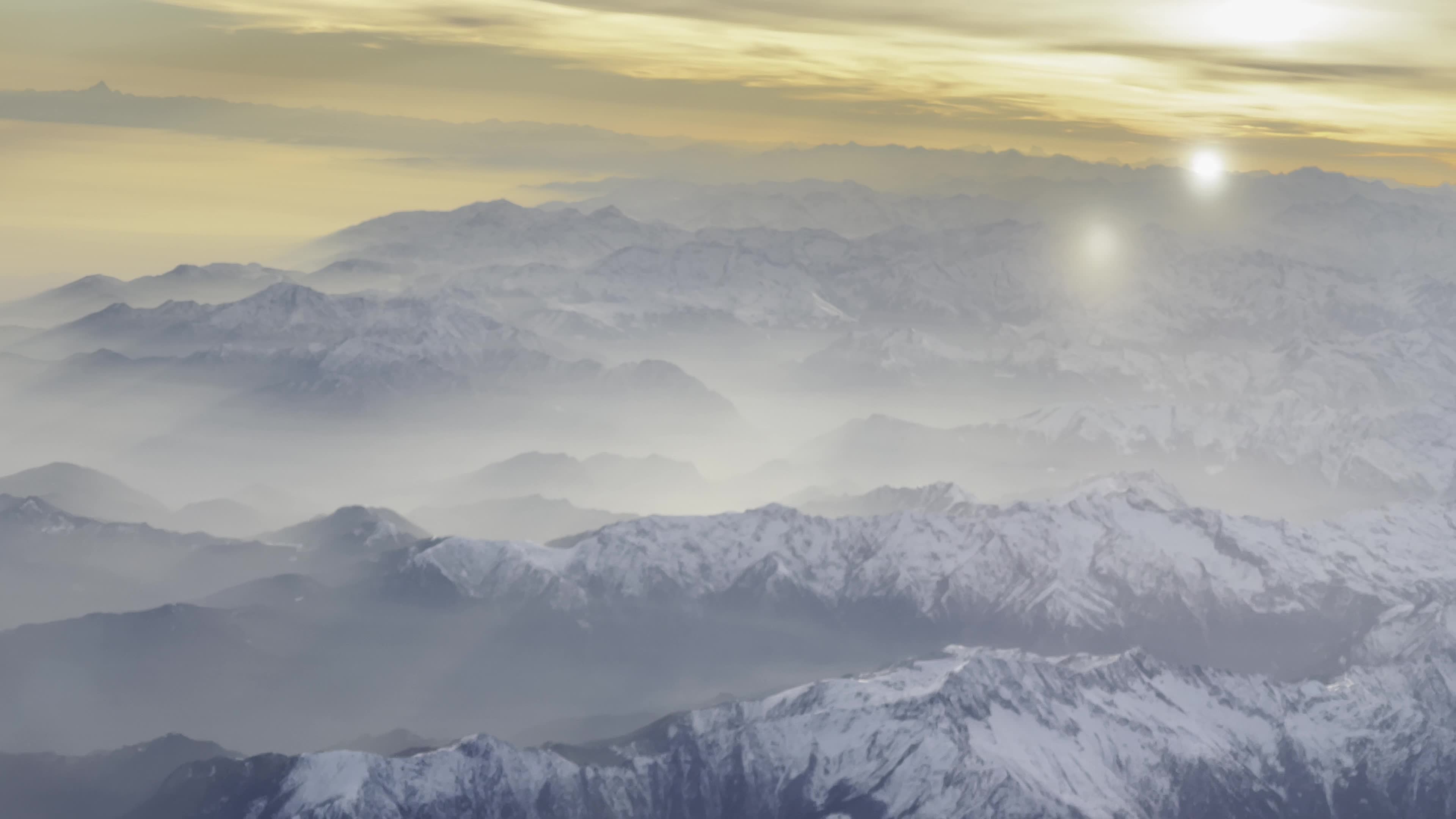Sunset Over The Alps During A Flight