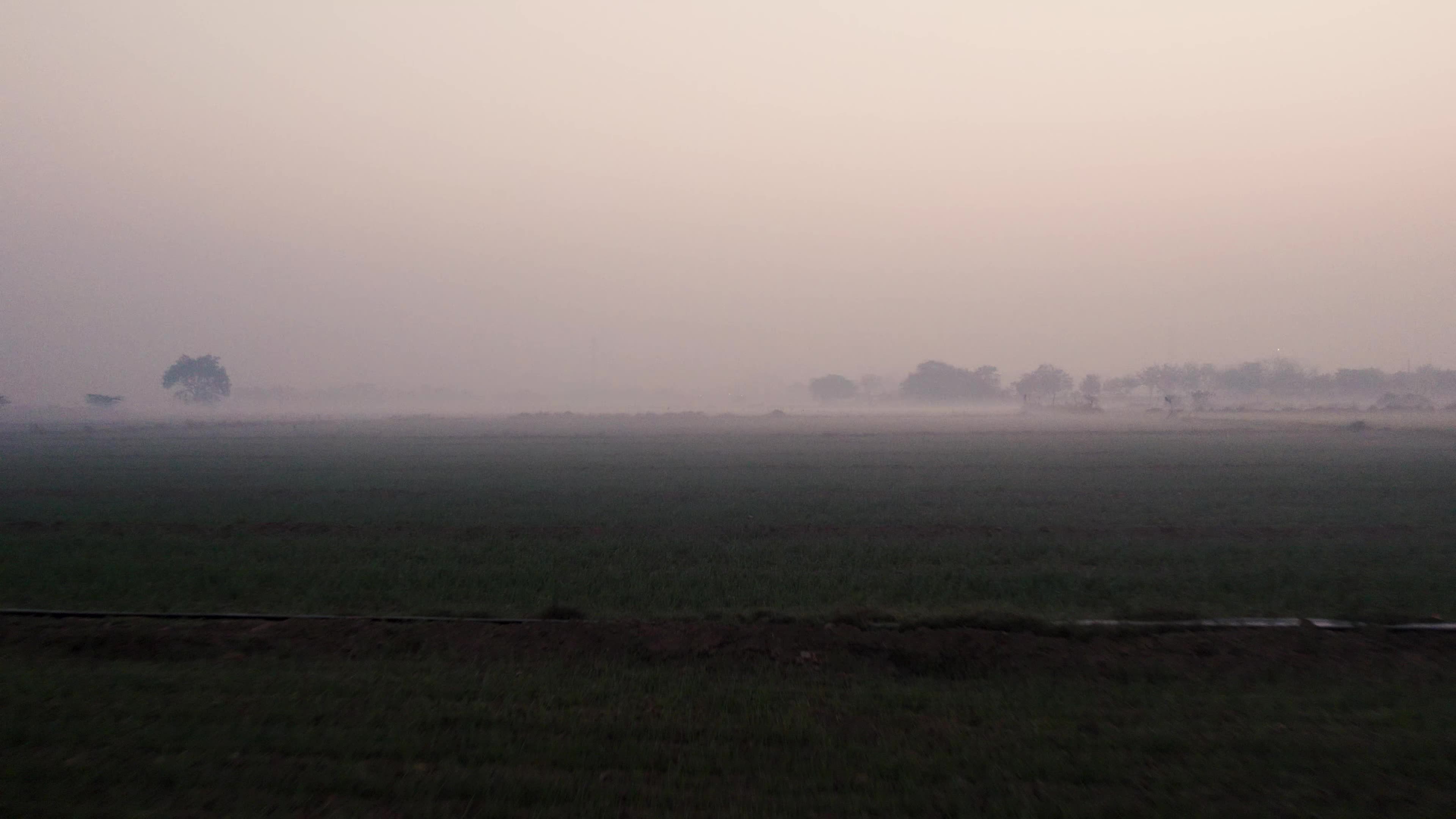 Aerial Video of empty fields on a winter foggy morning.