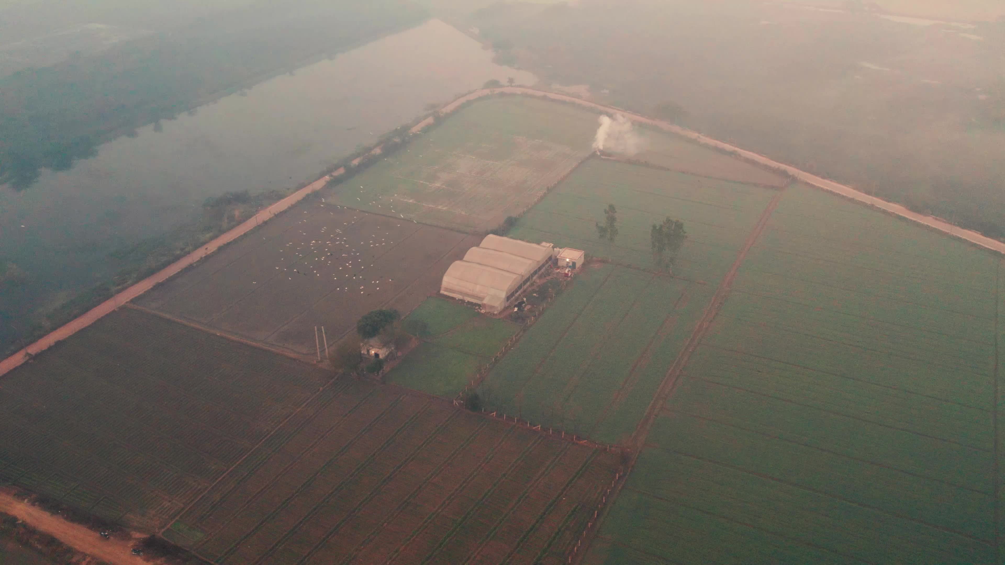 Drone video of a plastic Greenhouse made in the fields near the outskirts of New Delhi.