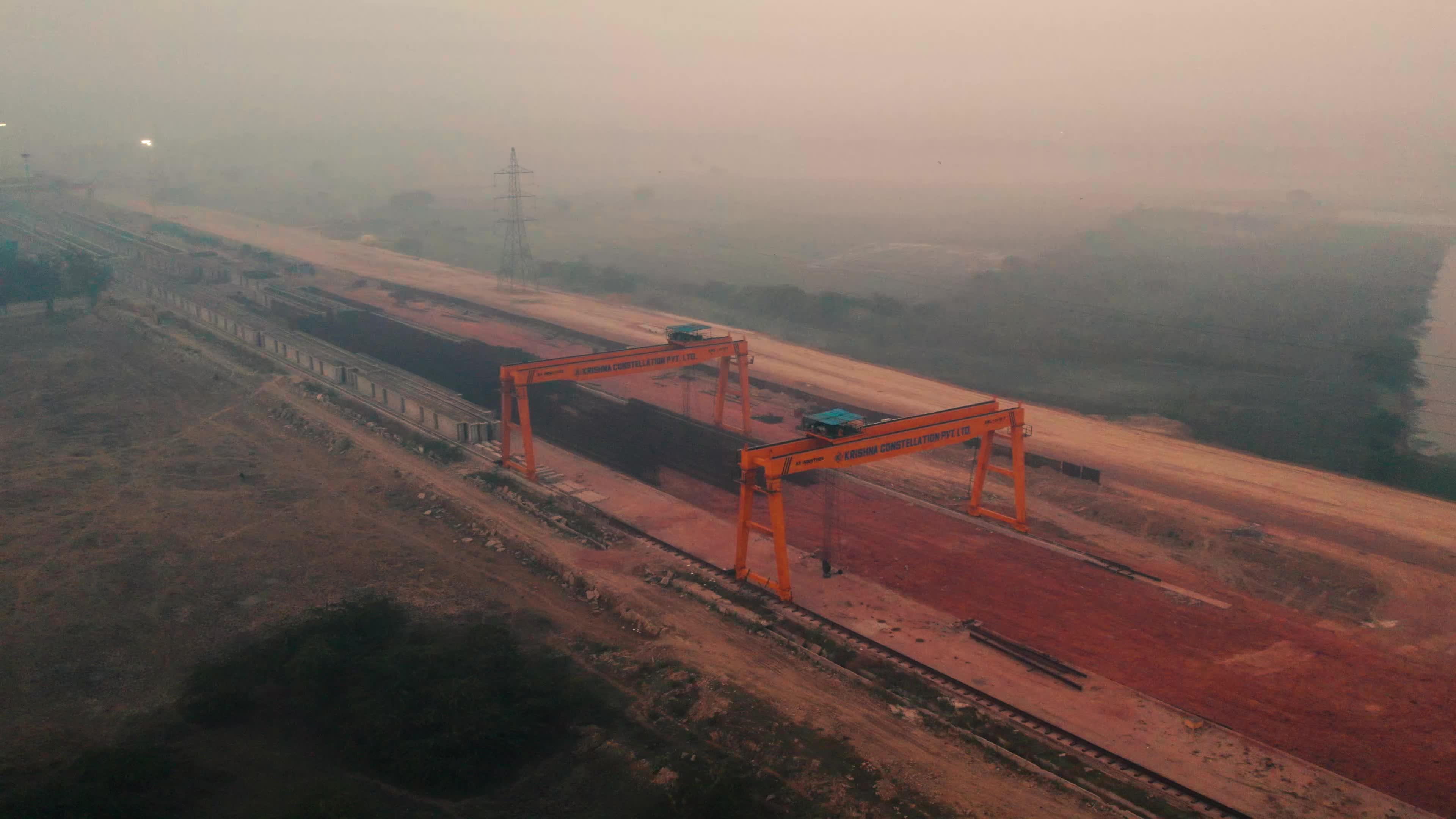 Aerial view of an under-construction highway and the Heavy Machinery used for the construction and maintain pace of roads and bridges