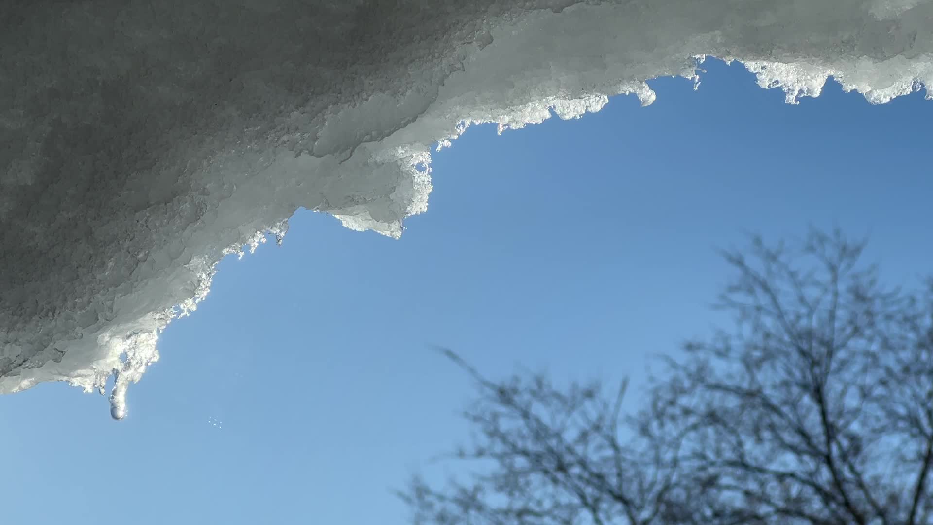 Snow and ice melting in the Winter sun